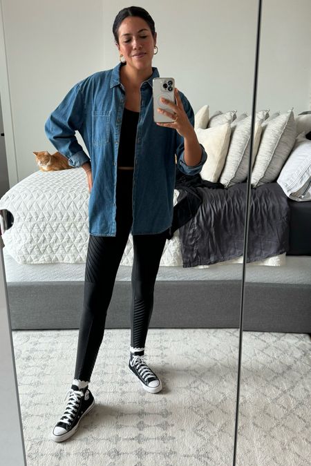 Be cozy without sacrificing cute! I paired Spanx moto leggings (size medium) with a Madewell crop tank (size medium) and threw an oversized denim shirt over the whole thing (this one is thrifted, but I’ve linked similar). High top chuck taylors with ruffle socks peeking out and gold hoops complete the look  

#LTKstyletip #LTKfindsunder100