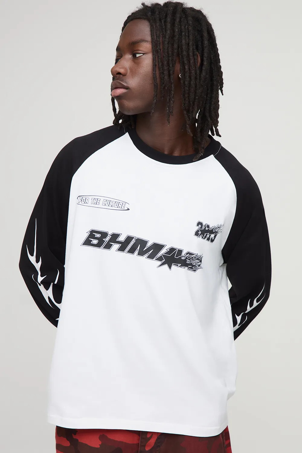 Black boohooMAN Moto Graphic Long Sleeve Raglan T-Shirt | Boohoo | Boohoo.com (UK & IE)