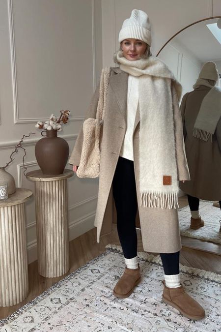 Three ways to wear leggings for winter - cosy cream look with Ugg ultra mini boots, cashmere socks, white h&m knit jumper, beige smart coat, Loewe scarf, white beanie hat and boucle bag  

#LTKstyletip #LTKitbag #LTKshoecrush