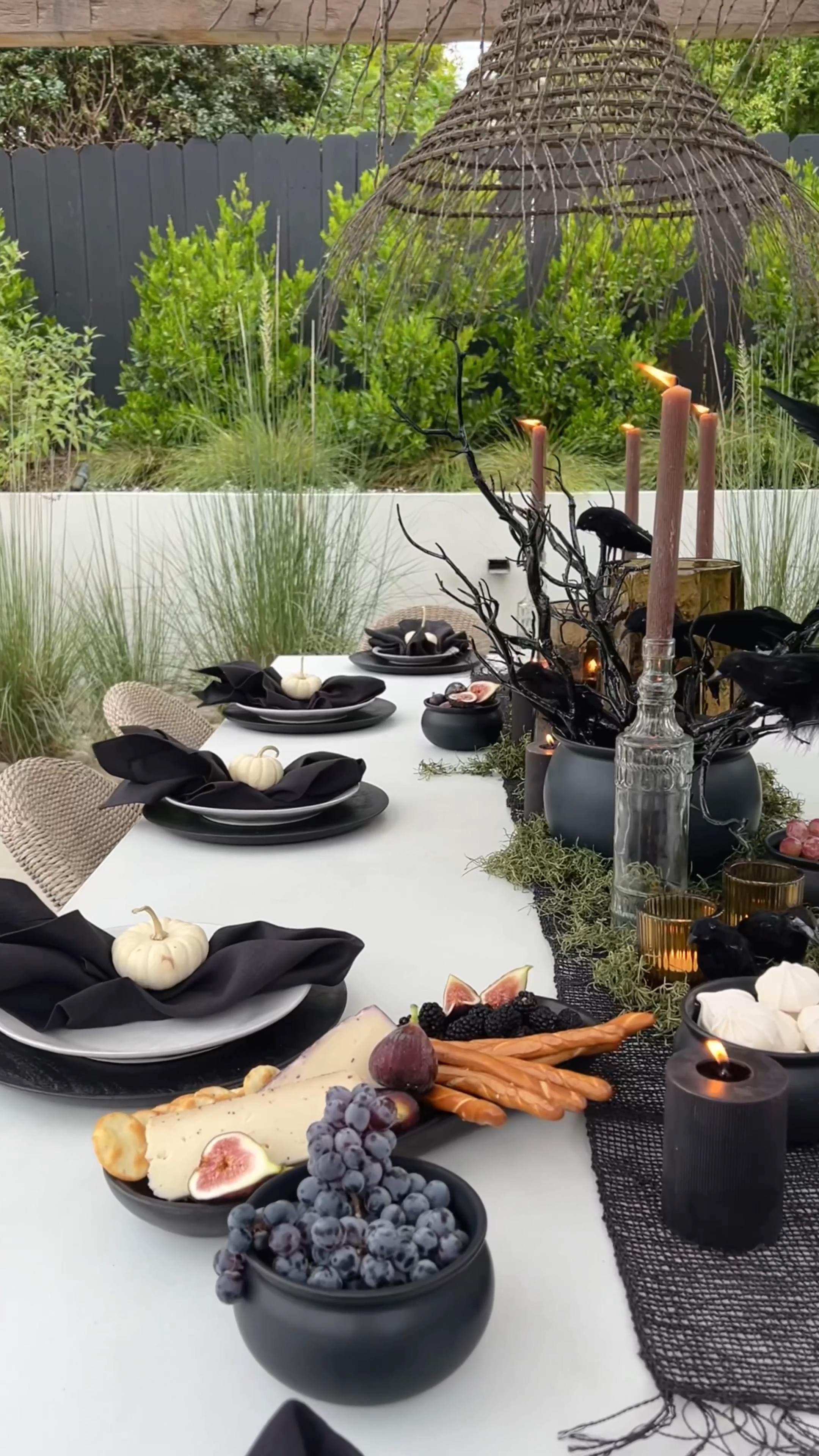 Neutral inspired Halloween party.

We styled this table with a cb2 table runner, large cauldron as a center piece, hurricanes with textured pillar candles, black wooden chargers, branches, creepy birds, and small white pumpkins for an elevated look. 

Halloween decor
Fall decor
Halloween 2024


#LTKHalloween 


#LTKHome #LTKSeasonal #LTKVideo
