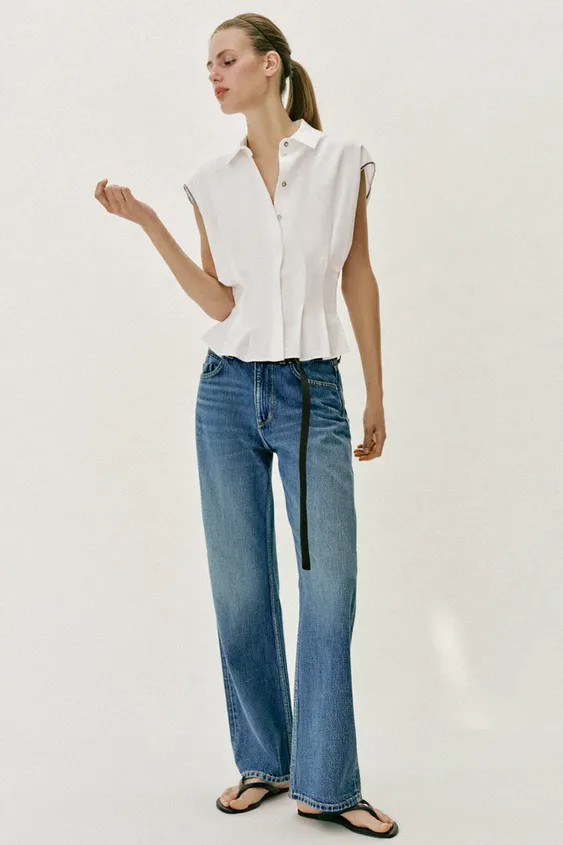 Top made from linen. Lapel collar and sleeveless design with contrast embroidery. Fitted waist wi... | Zara US