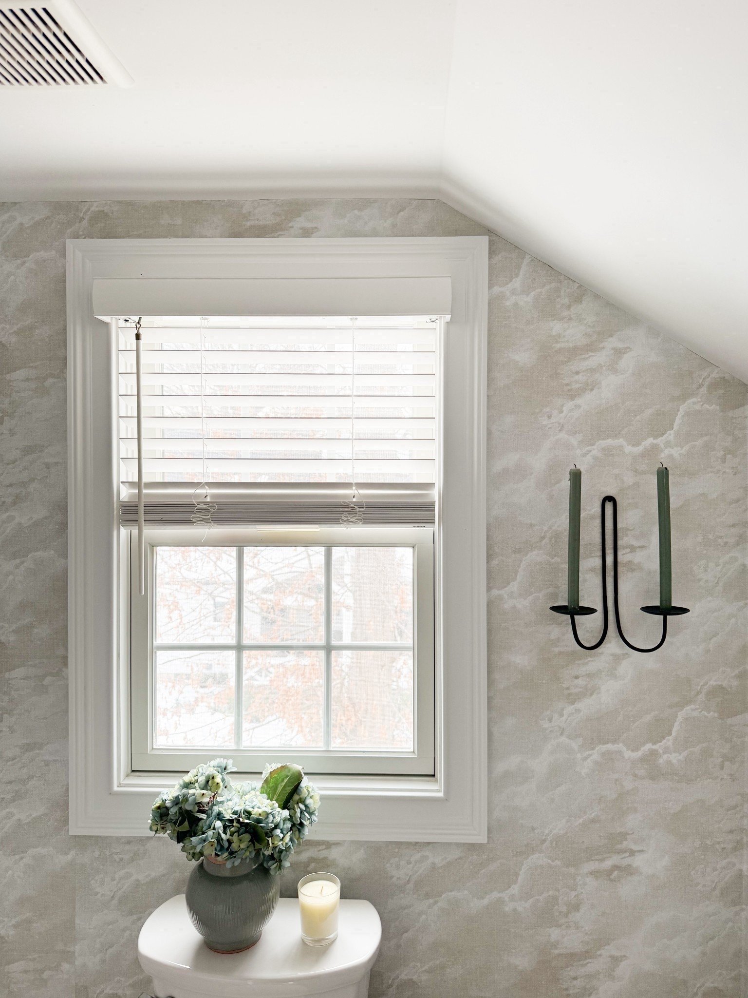 This view really shows how the wallpaper and natural light work together to create such a soft, calming atmosphere. The layered neutrals, paired with the simple sconce and subtle styling on the toilet, make the entire space feel airy yet thoughtfully finished. A beautiful example of how small details and textures can completely elevate a bathroom.

neutral bathroom decor, bathroom wallpaper ideas, small bathroom inspiration, soft neutral interiors, cottage style bathroom, bathroom window styling, wall sconce decor, cozy home details, elevated everyday spaces, light and airy design girlonthehudson

#LTKdayinmylife #LTKHome #LTKSeasonal
