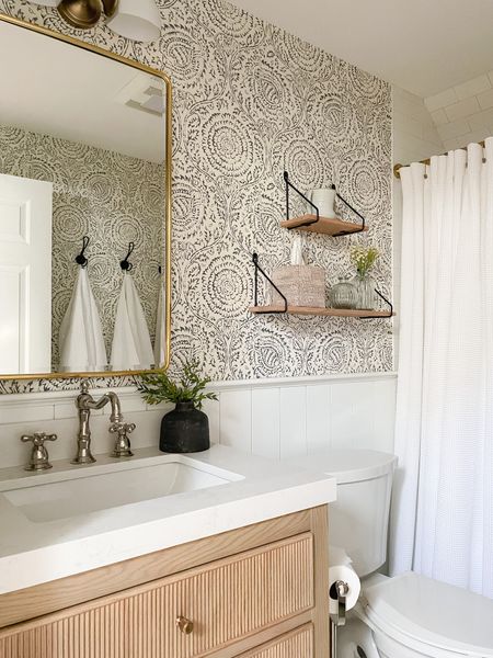 Wallpaper, shelves, vanity mirror and sconce, shower curtain, bathroom essentials 

#LTKstyletip #LTKhome #LTKfindsunder100
