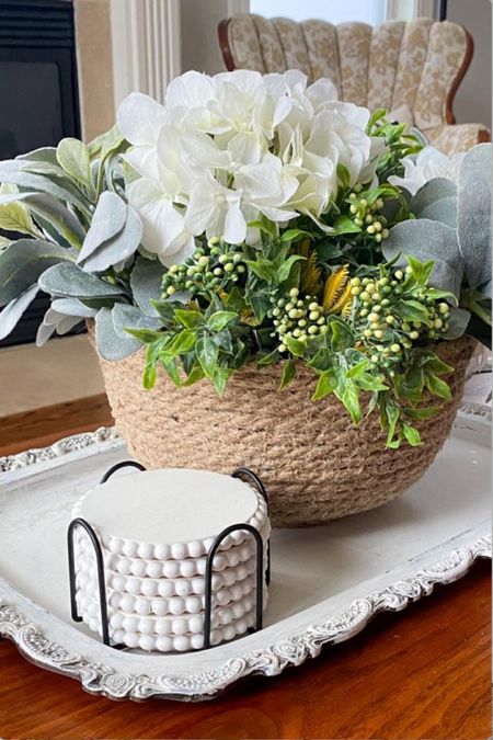 Loving this elegant farmhouse coffee table look in my living room! What do you think of my fake hydrangeas, lambs eat, and new coasters? 

Perfect for a spring coffee table decor styling!

Farmhouse styled coffee table | round coasters | farmhouse coasters | rope bowl | antique tray

#LTKhome #LTKSeasonal #LTKfindsunder50