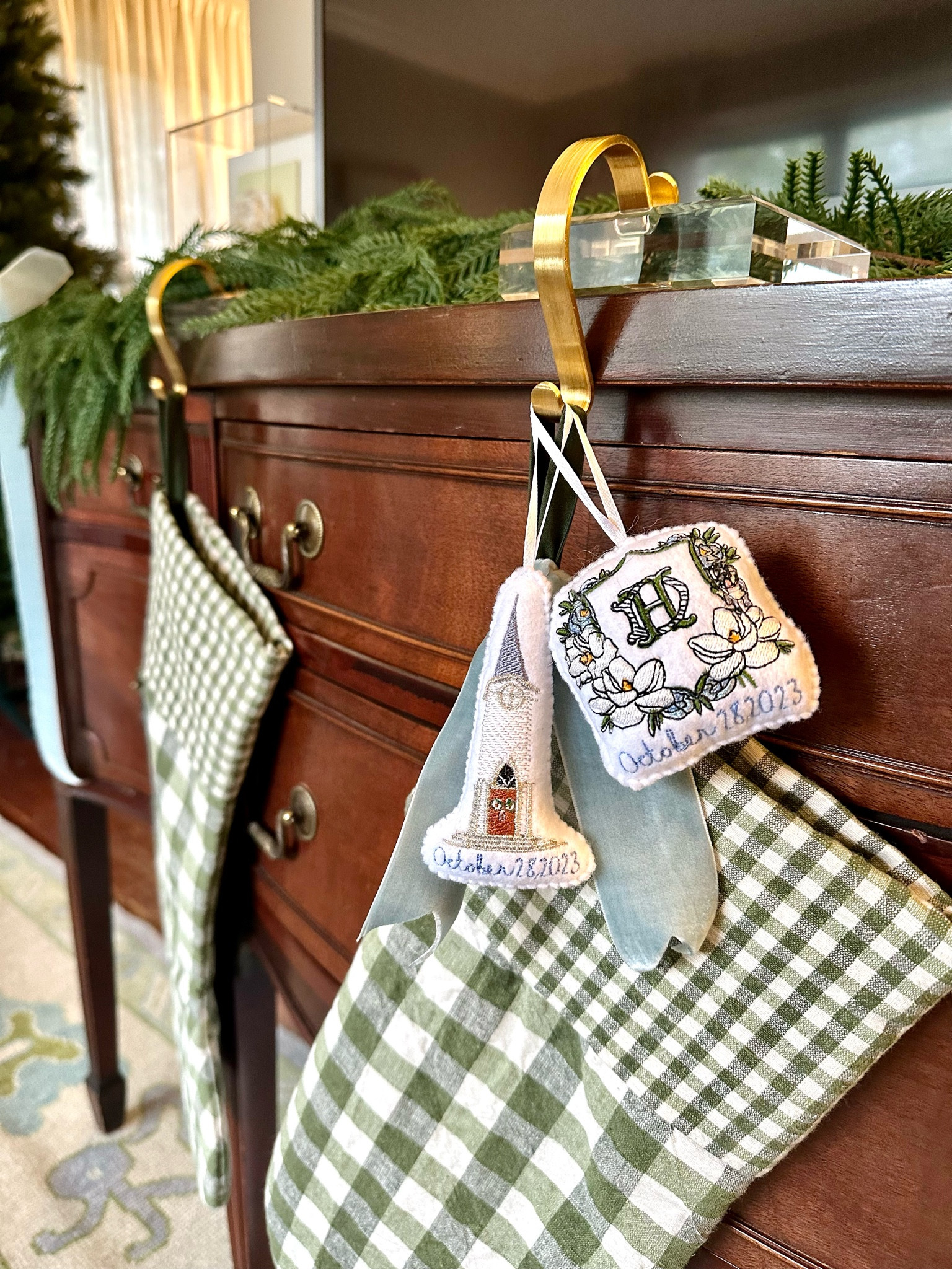 I’m a bit embarrassed to admit where my faux greenery garland is from, but I am pleasantly surprised with how it looks! I’ve linked our garland, ribbon, stockings, and stocking holders which are a good mix of high and low items as you decorate and decide how you’d like your Christmas decor to look! 

Affordable Christmas decorations, Christmas decor, fake garland, faux garland, gingham stockings, acrylic stocking holders, velvet ribbon, southern traditional home decor 

#LTKFindsUnder50 #LTKFindsUnder100 #LTKHoliday