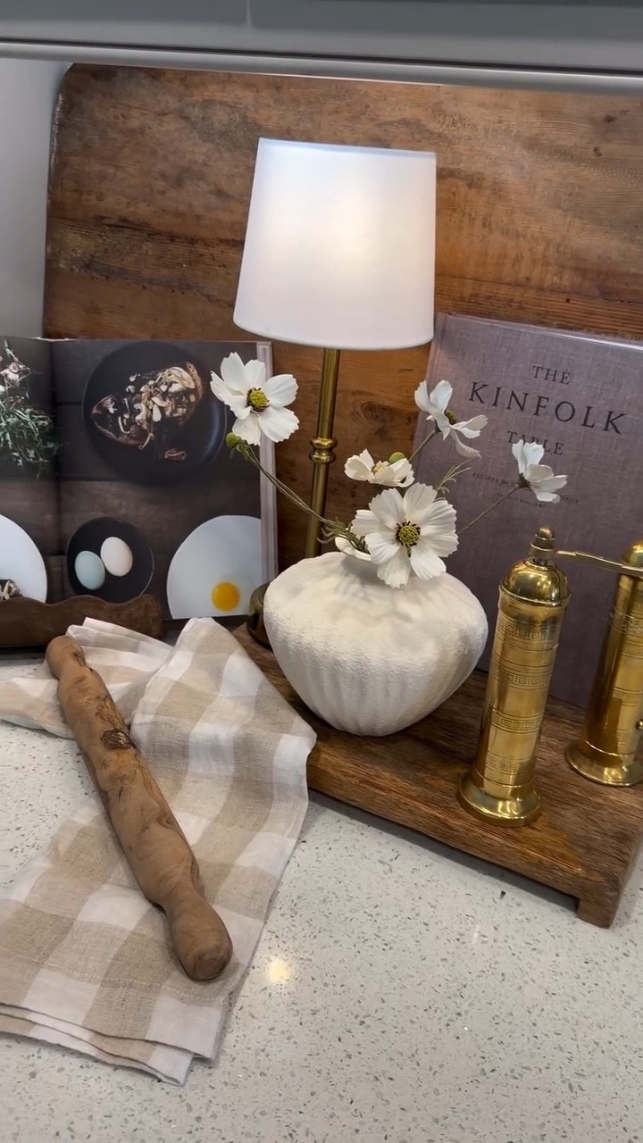 Comment “KITCHEN” and I’ll send you the links to everything I used. https://liketk.it/66WgY

I love keeping my kitchen counters styled but still functional. A few wood boards, brass dispensers, faux florals, and a small lamp instantly warm up the space and make everyday cooking feel a little more elevated. 

Simple layers that bring texture and life to the kitchen without adding clutter.

#kitchencounterstyling #kitchendecor #kitcheninspo #neutralhome #homeinspiration decorideas kitchenstyling homedetails