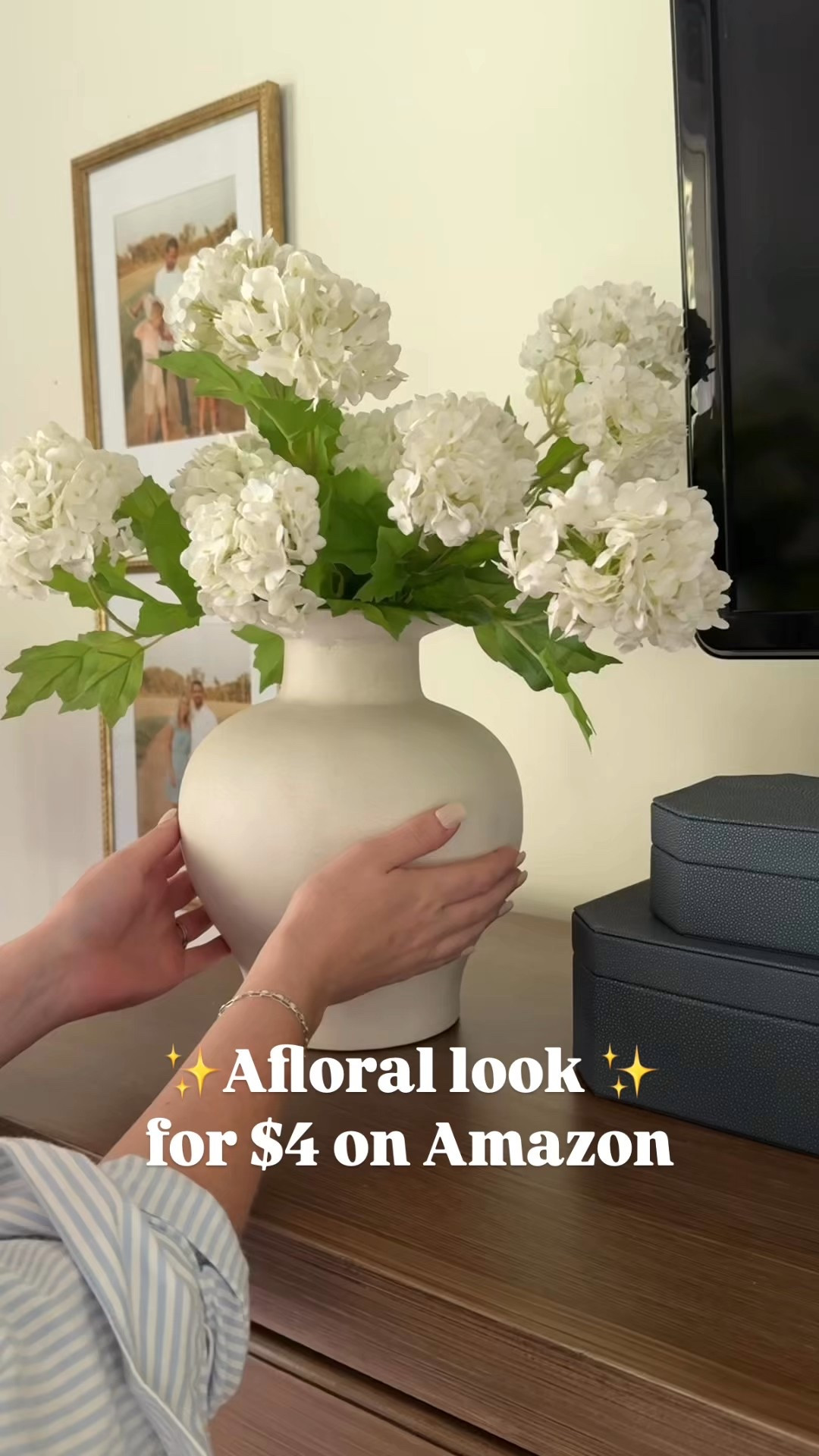 If you love the cream white snowball flower from Afloral, this is a great look-for-less option — just $4 a stem vs. $44, and it’s from Amazon! 🙌

I love my Afloral stems, but when I wanted to recreate the look in our bedroom, I went searching for something a little more budget-friendly — and this version totally hit the mark.

I used 8 stems in this arrangement, bending the wires slightly to give it that soft, organic shape. The Target exaggerated side-brim vase was the perfect vessel to finish the look.

#LookForLess #AmazonHomeFinds #FauxFlorals #AfloralDupe #BudgetFriendlyDecor #ModernTraditionalHome

#LTKSeasonal #LTKFindsUnder50 #LTKHome