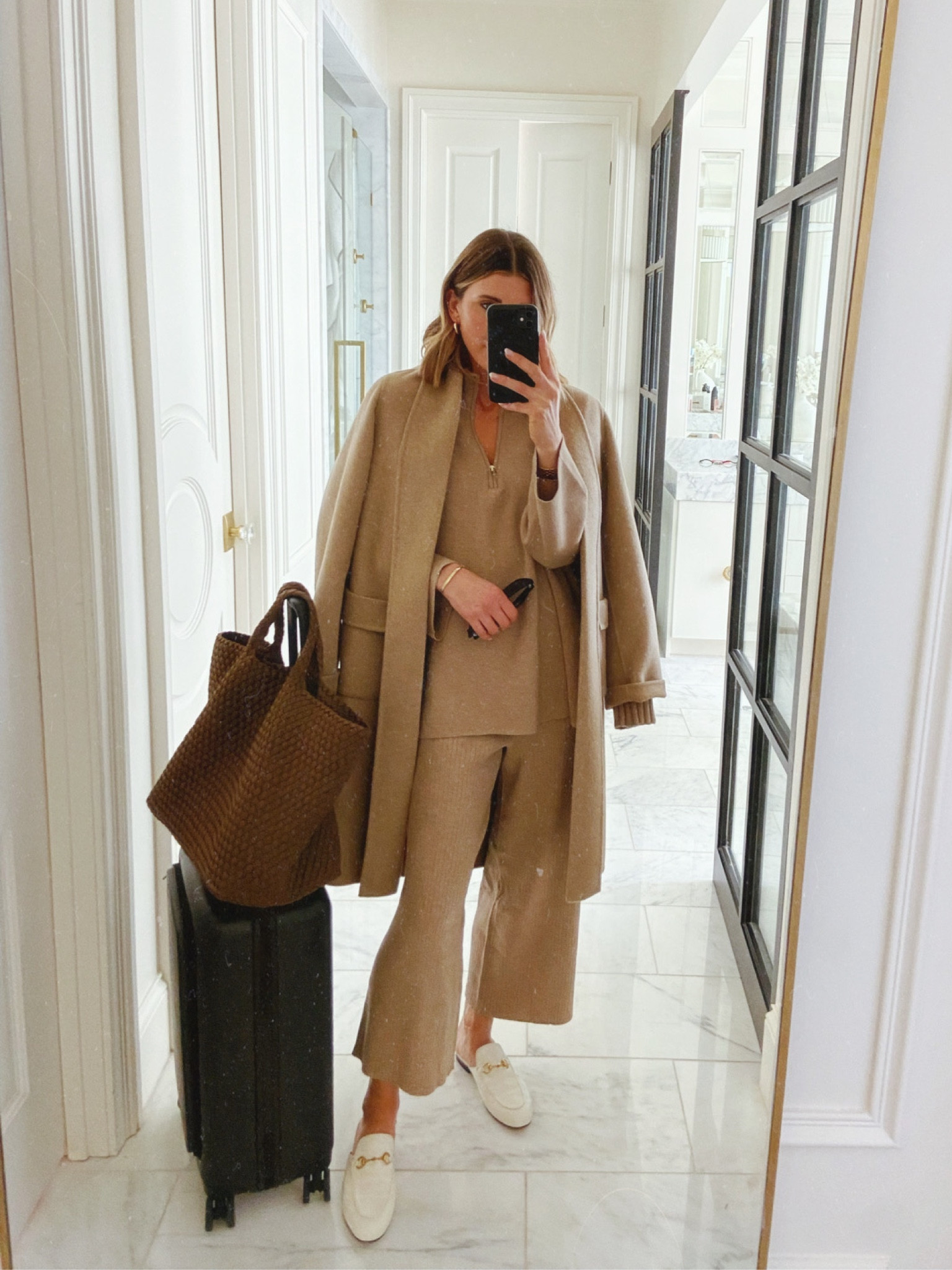 I'm wearing size small in the half zip sweater, ribbed wide leg pants and icon coat. 