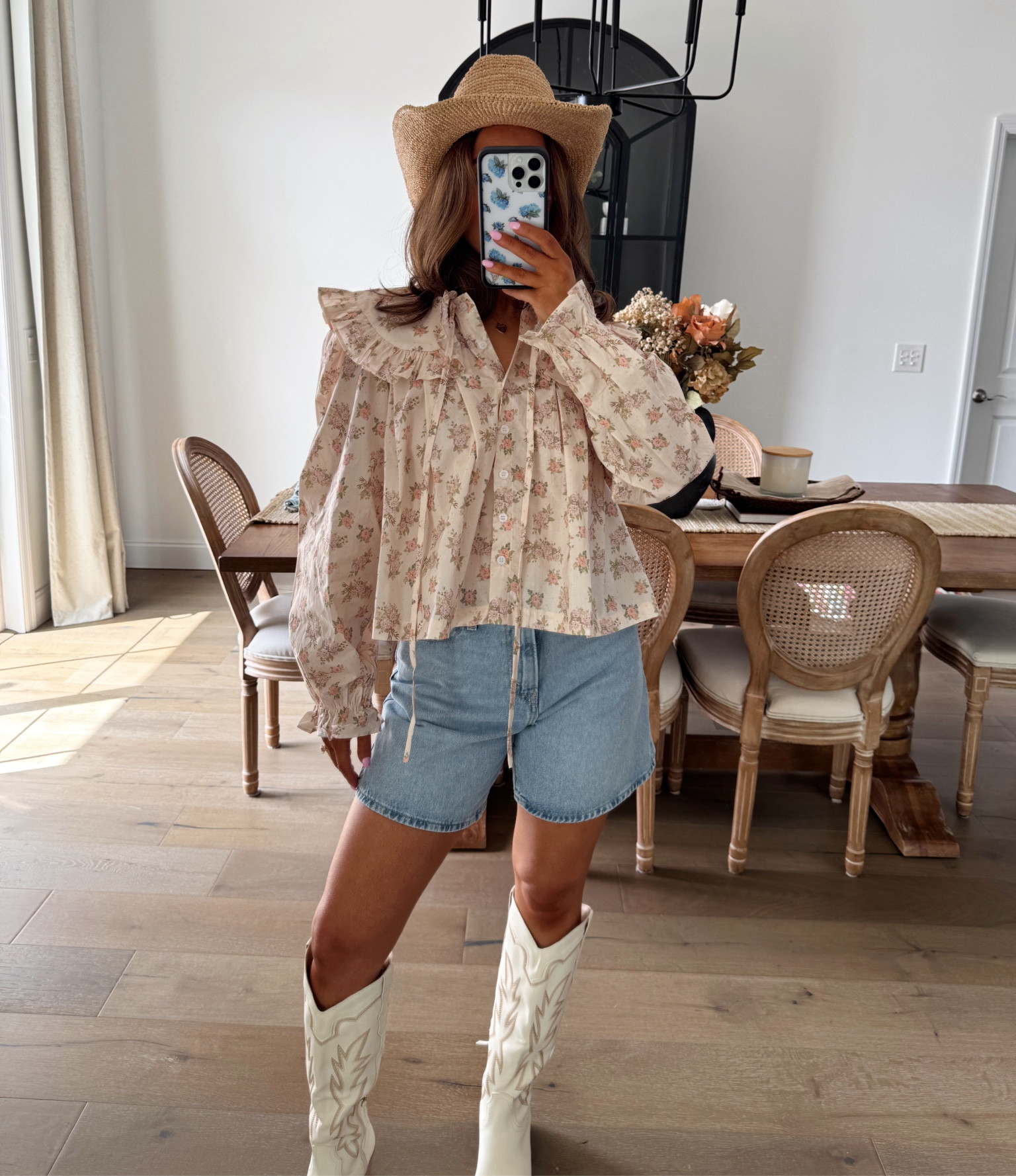Bold blooms and country vibes Rockin’ a floral puffed sleeved shirt with boots and jean shorts — ready to dance ‘til the stars come out! 
