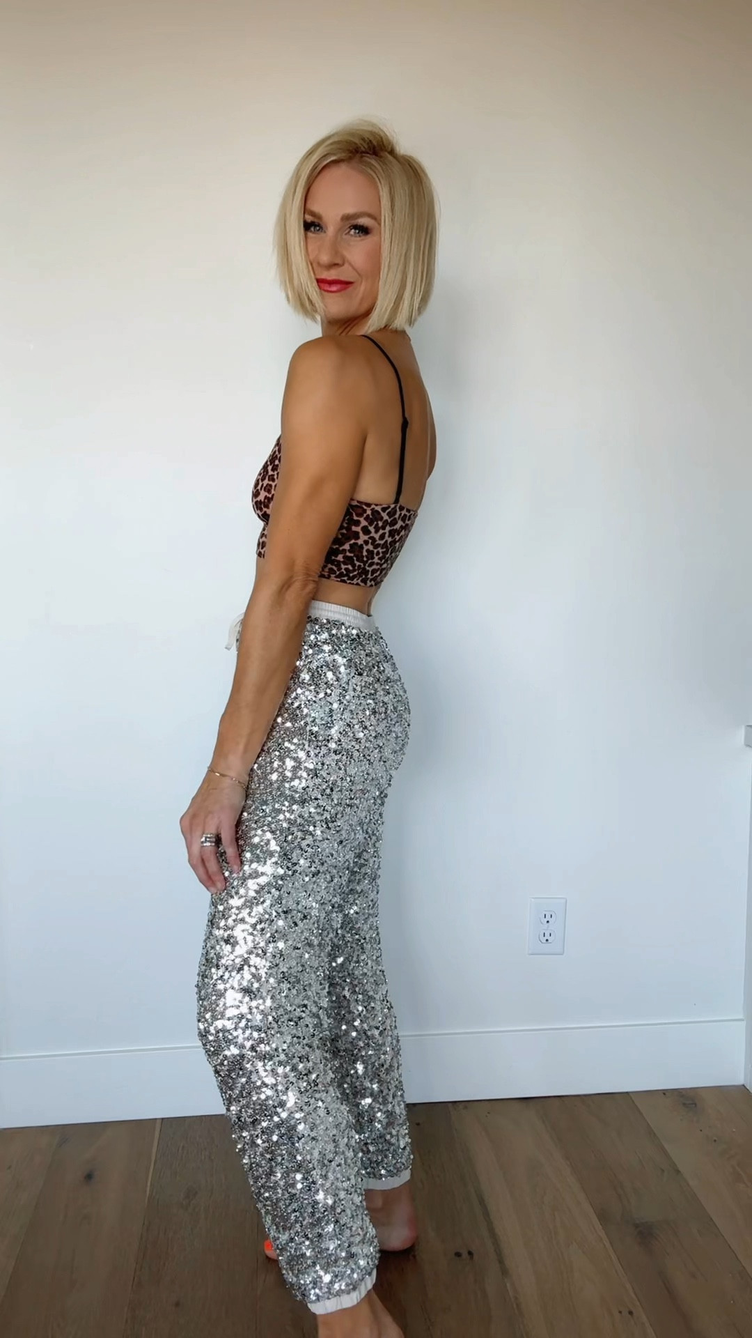 New years eve outfit idea! These joggers are incredibly soft/comfortable and obviously FUN! I plan to wear these again & again for special occasions & parties. Denim shirt & Red sneakers just restocked! 
sizing ~
Sequin pants: fit tts. Wearing a medium
🐆 bralette: sized up to a L for a longline fit
Denim shirt: I sized up to a large for a looser, oversized fit
Sneakers: fit tts
🚨🐆coat: it is sold out, but I linked a few gently used ones on POSHMARK 

#LTKFindsUnder50 #LTKParties #LTKHoliday