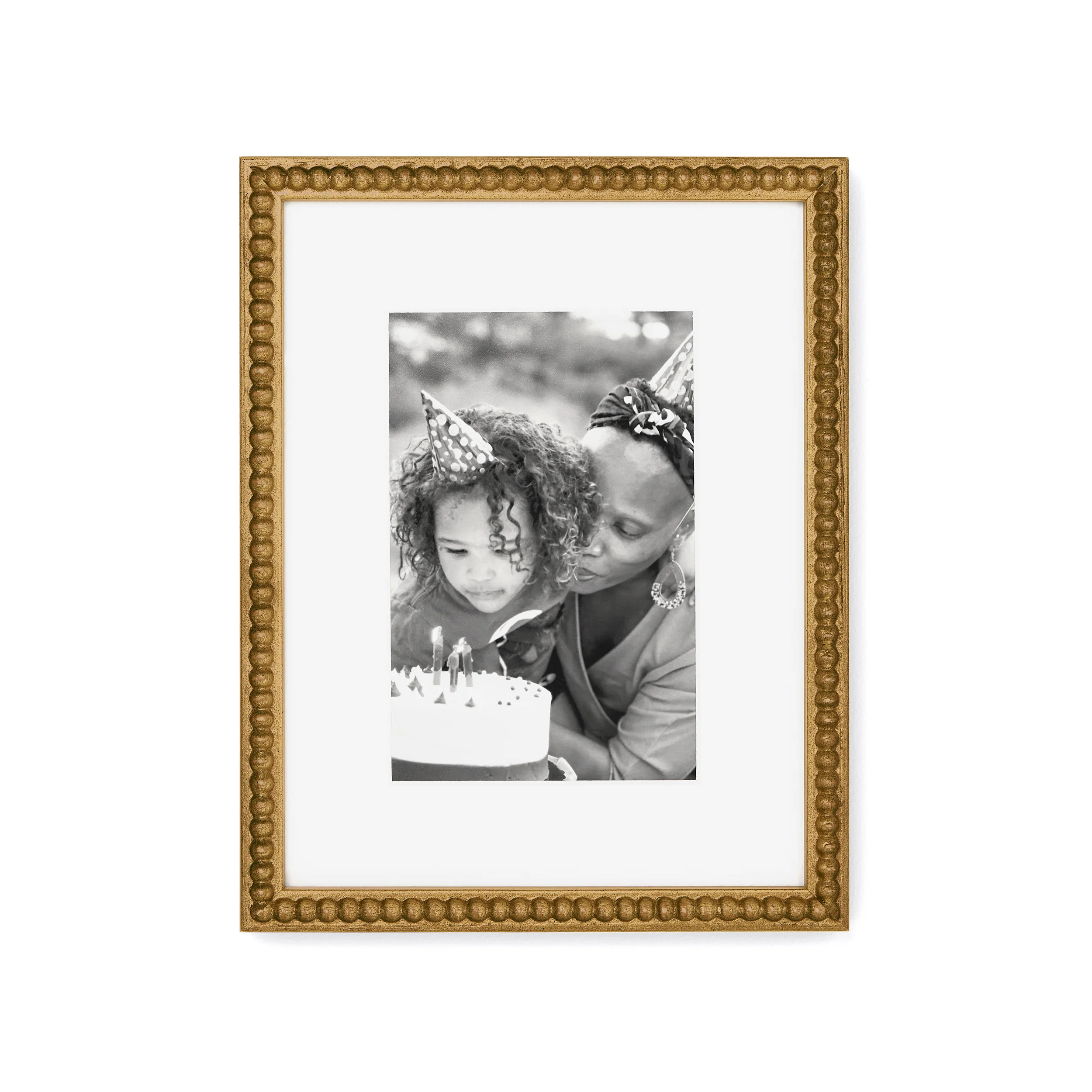 Slim, beaded wood frame with antiqued gold leafing | Framebridge