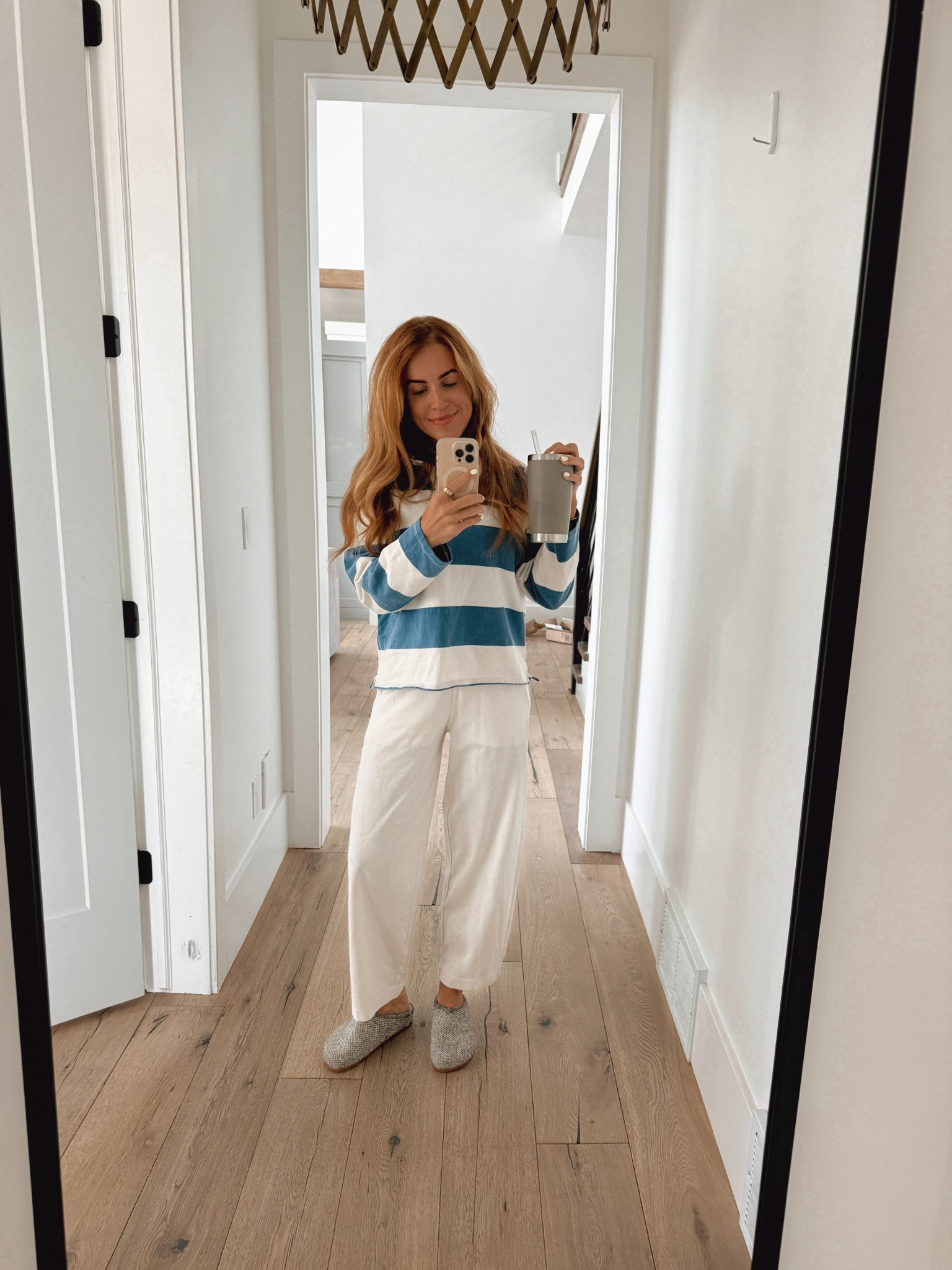 Shirt is from Levi’s! Love the rugby style. I’m in the small. It’s on sale right now!

Pants are from Everlane and are soooo good. I’m in the XXS, but could have gone with the XS. I’m typically a small do definitely recommend sizing down!

Rothy’s. They’re technically shoes because they have a hard soles bottom but I’ve dedicated this pair to be strictly house shoes aka slippers. You could totally wear them out and about if you wanted! I do that with my other colors. I’m typically and 8-8.5 and get the 8!

Had a few questions about my cup.. it’s yeti! It keeps drinks cold for sooo long. I’m all for insulated cups!