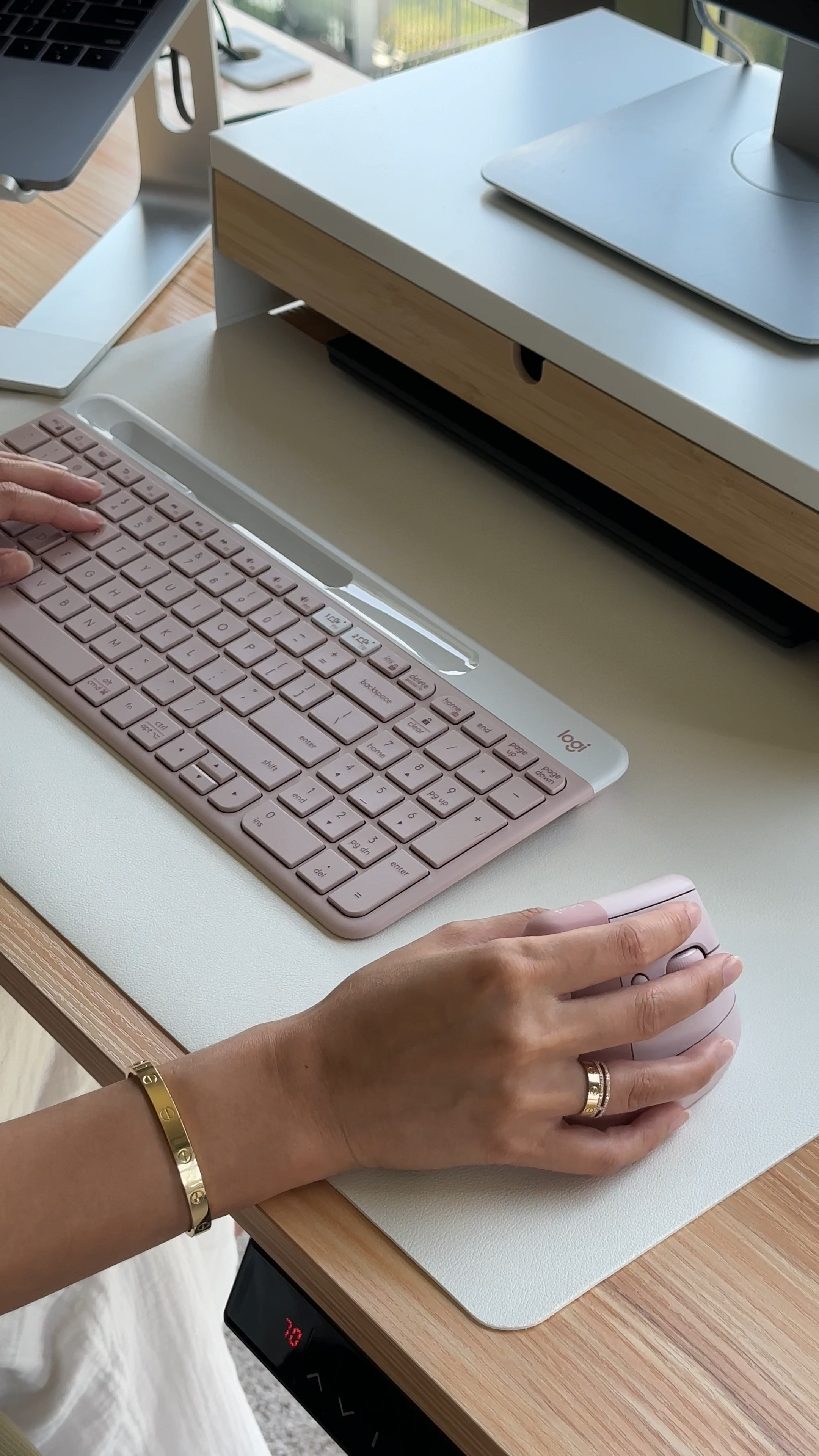 Just because I work a corporate job, doesn’t mean everything needs to be black 💕

Unboxing the keyboard and mouse of my dreams! They’re literally the perfect shade of pink and add a nice pop of color to my desk setup.

The best part is that this keyboard works for both PC (my work laptop) and Mac (my personal laptop) - I used to have two keyboards at my desk and would switch between them depending on which laptop I was using. I also appreciate that the keyboard AND mouse have buttons to quickly switch between devices, so no more going into my settings and fumbling with the bluetooth connection because we can all admit that’s a pain.

#LTKU #LTKBacktoSchool