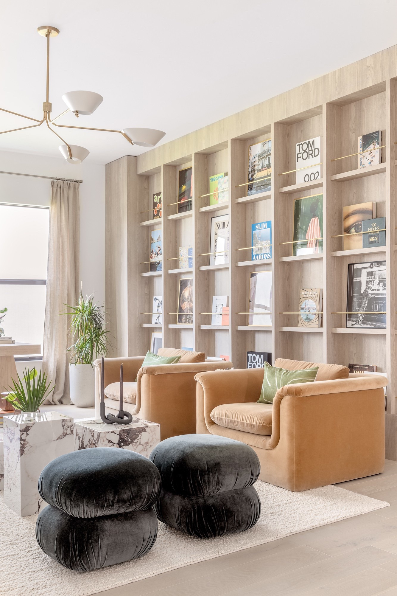 The Boca Raton Essex House. The library space originally designed to be a formal living room but is being reimagined for a modern family. Custom-built book and art ledge. 

#LTKHome #LTKFamily