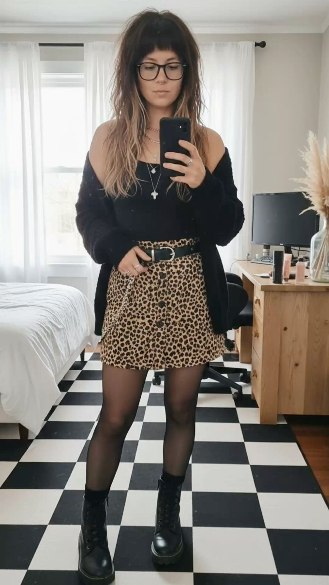 Leopard is the new neutral! I’m obsessed with how this button-front animal print skirt pairs with a cozy oversized cardigan for that perfect "undone" vibe. It’s the ideal transitional outfit for coffee dates or a night out. I’ve linked my favorite platform combat boots, sheer tights, and a few similar leopard minis to help you recreate this edgy, indie-inspired look.

#LTKootd #LTKSeasonal #LTKmomlife