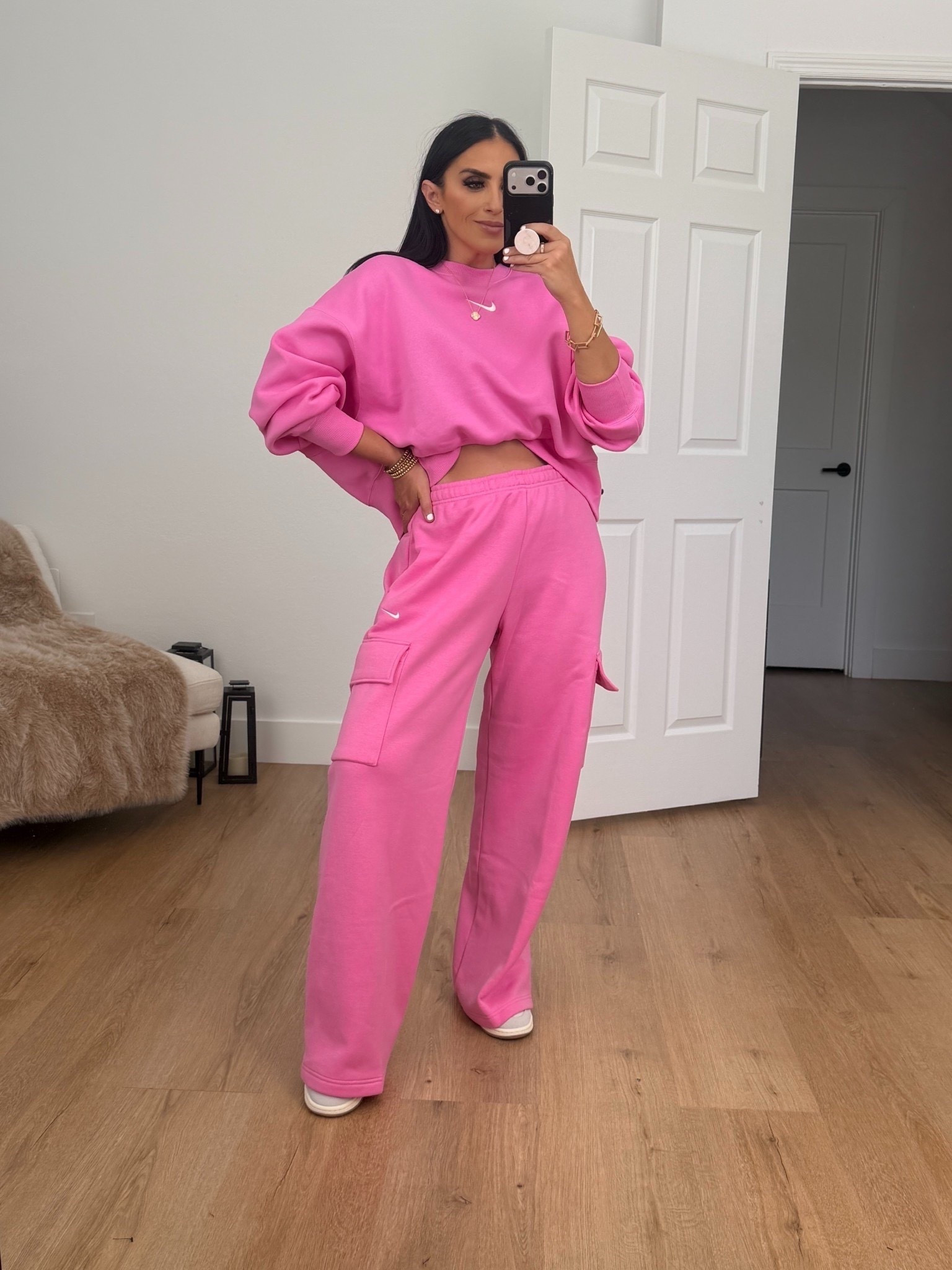 Woman’s Nike Sportswear Phoenix Fleece Over-Oversized Crew-Neck Sweatshirt. I’m wearing a size small.

Woman’s Nike Sportswear Phoenix Fleece cargo pants. I’m wearing a size medium. 