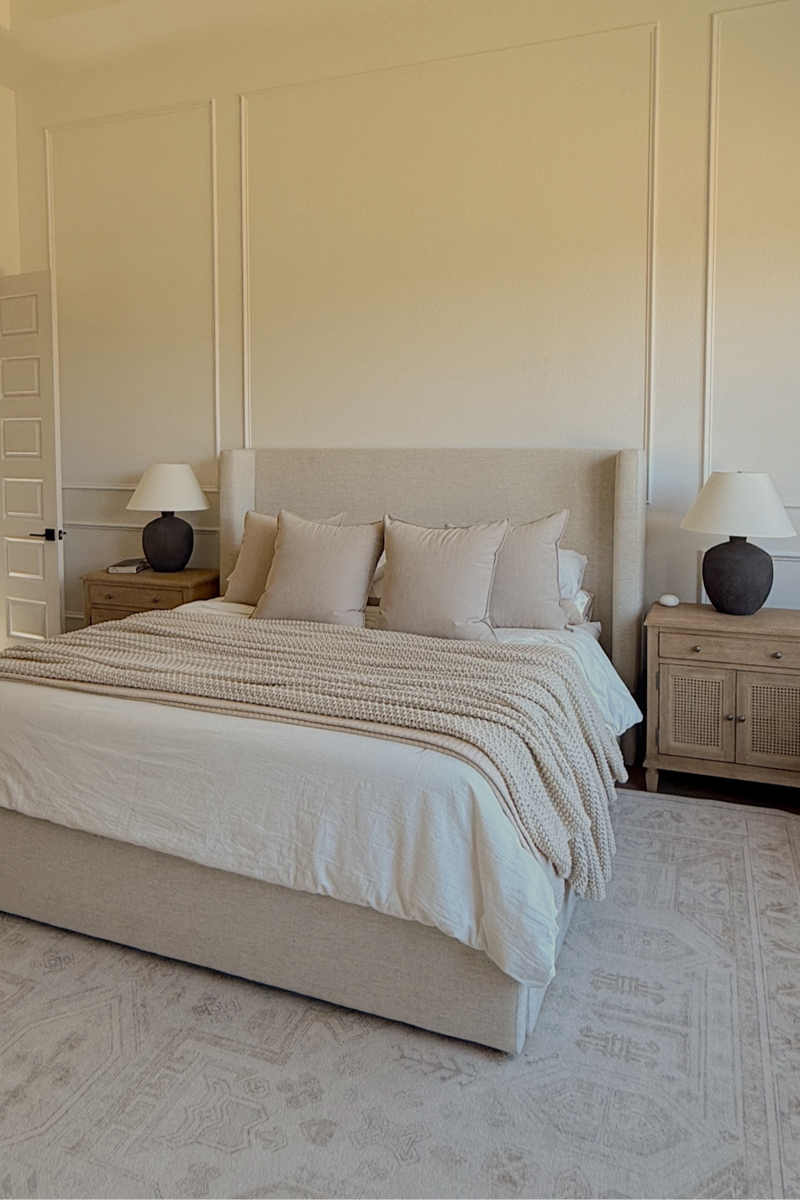 love a made bed 🖤 relinking everything in our bedroom. comforter: off white // square pillows: 26x26 // square pillow covers: 24x24, beige // bed frame: twill sand- tall. // 24” lamp 🤍