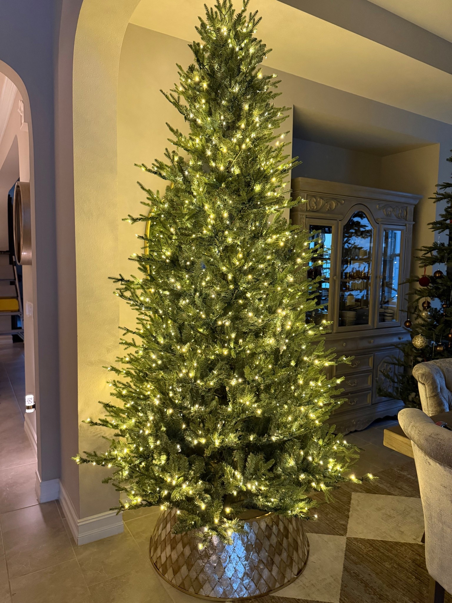 Why have I not seen anyone sharing this tree! I’ve seen lots of other twinkle Christmas trees, but I haven’t seen anyone share this one! When I saw it in the store today, I knew I had to have it for my dining room! The subtle twinkle function is so magical and it’s such a great size. It’s 9 feet tall but it isn’t super wide so it’s perfect for tighter spaces. The branches are a very pretty green color and look very realistic. The best part is that it takes about five minutes to set up. Minimal fluffing required!

#LTKHoliday #LTKHome #LTKSeasonal