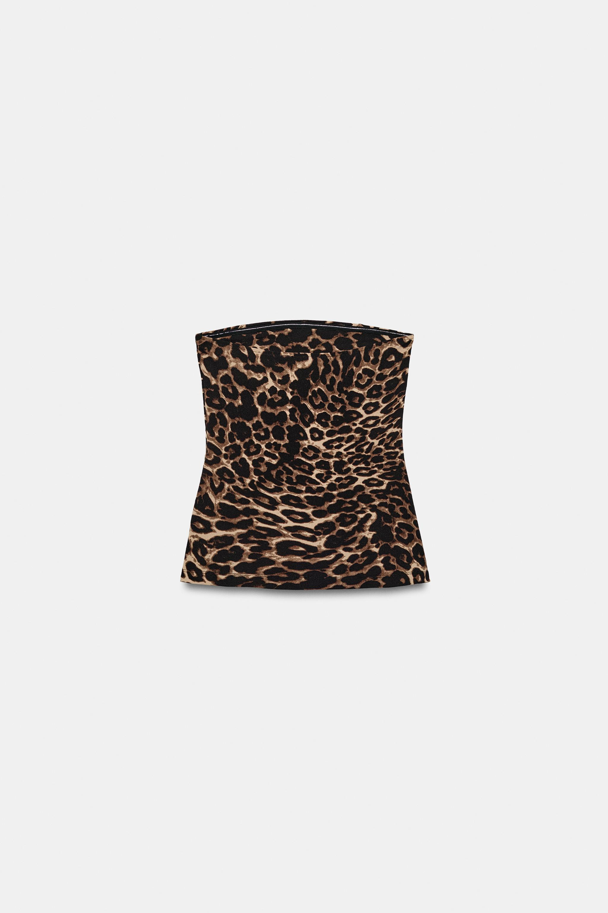Top made of stretch fabric. Animal print. Straight neckline and strapless design. Hem with side v... | Zara US