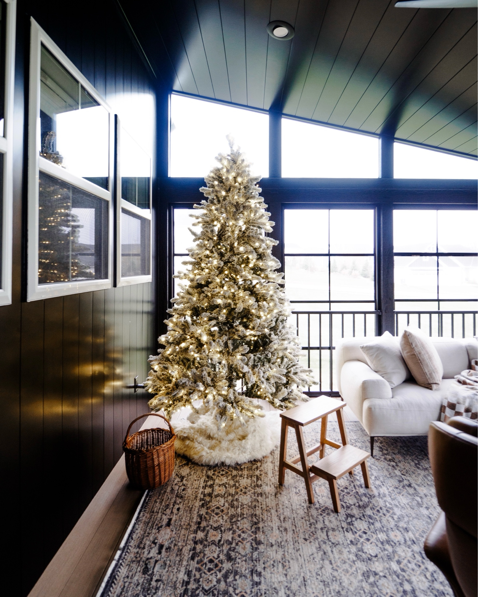 Flocked christmas tree screened porch winter snow  moody interior

#LTKHoliday #LTKSeasonal #LTKHome