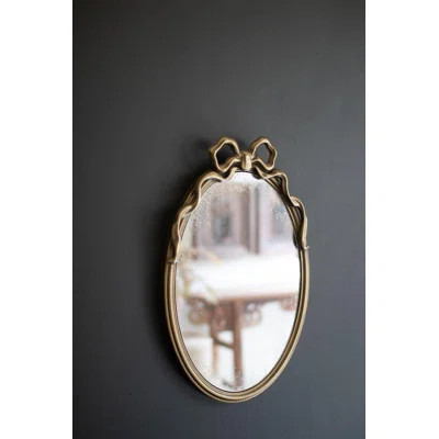 FRAMED ANTIQUE GLASS MIRROR WITH BOW | Wayfair North America