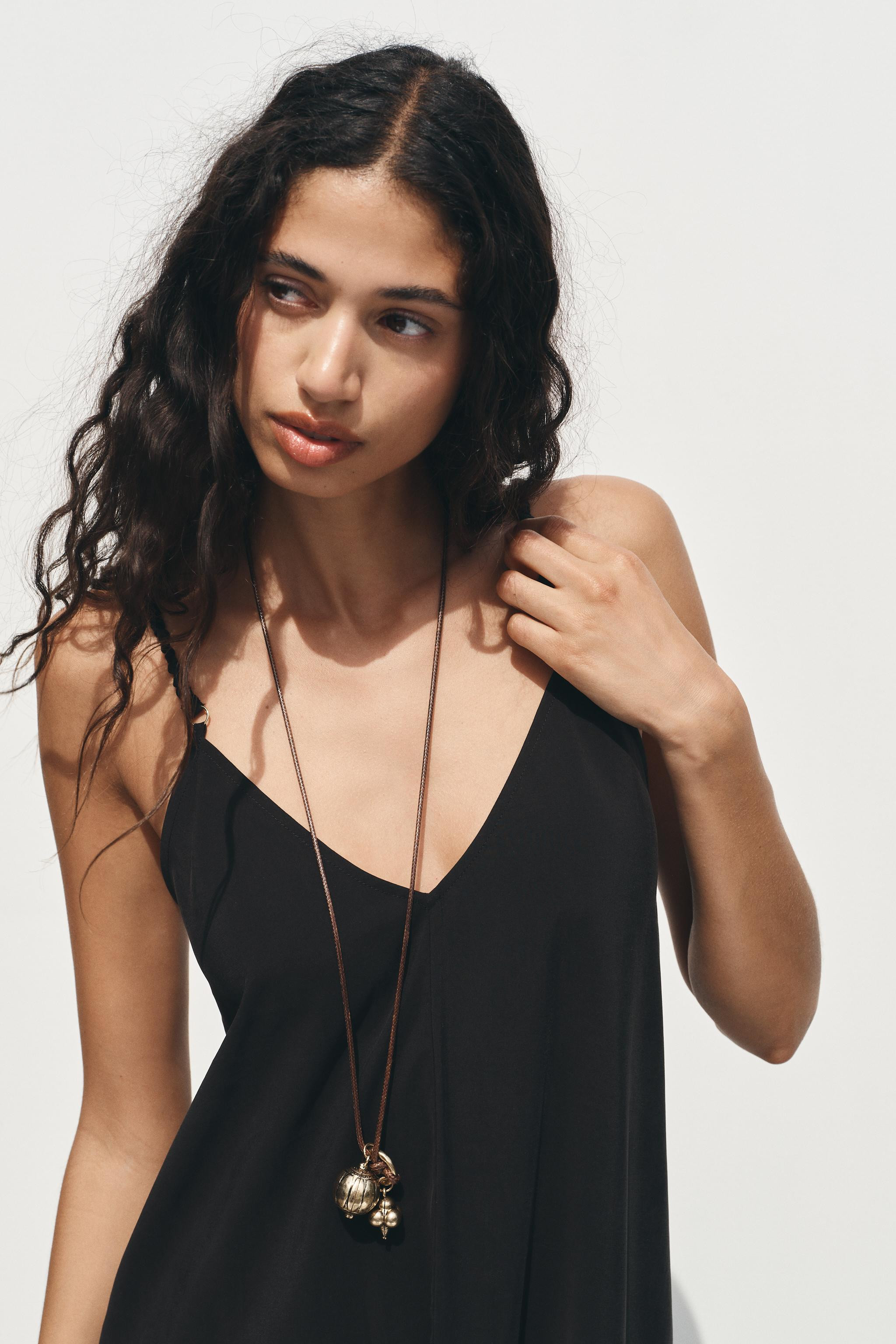 LONG STRAPPY DRESS$ 49.90 Black Terracotta BrownBlack | 8372/092/800Add to cartAddFlowy V-neck dr... | Zara US