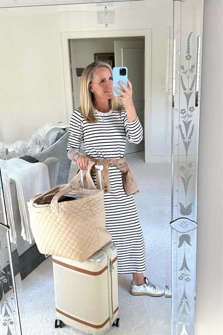 Favorite travel look 
Comfortable travel style 

Love this super soft striped tshirt dress from Tuckernuck. It’s my all time favorite travel look! 
Paired with Spanx AirEssentials half zip on black and Veronica beard sneakers. They run tts and are SUPER comfortable 
Best carry on suit case from Paravel and tote from MZ Wallace 


#LTKSeasonal #LTKtravel #LTKover40