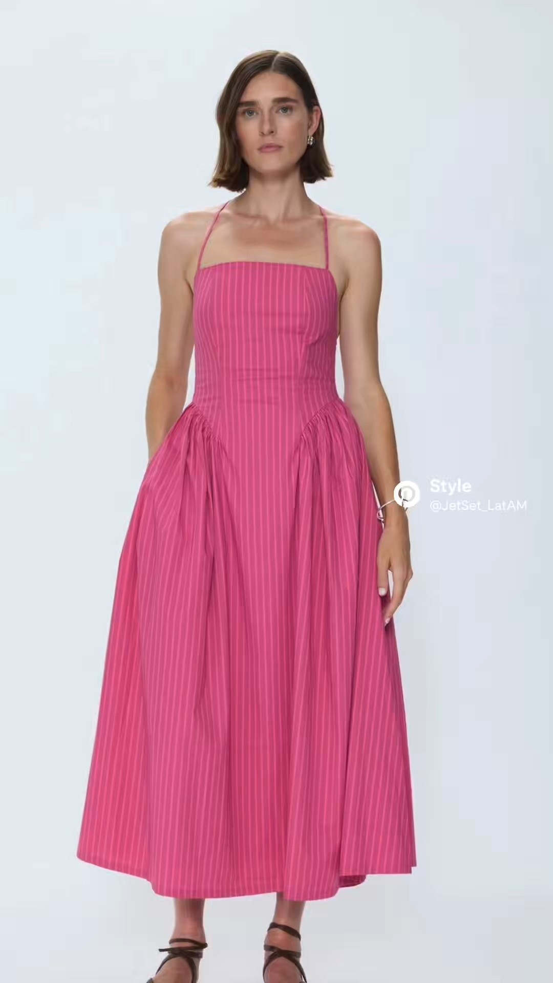 I love when a piece reads easy + intentional at the same time. This Pistola Sadee dress is exactly that: a halter-tie, open-back maxi/midi moment with vertical magenta stripes that lengthen the silhouette and a softly voluminous skirt that moves beautifully when you walk. It’s the kind of warm-weather resort dress that transitions from poolside afternoon to golden-hour dinner without needing a second outfit.

Style notes I’m into:
	•	minimal jewelry (let the stripes do the talking)
	•	flat sandals for daytime, barely-there heels for night
	•	hair up to highlight the open back
	•	a light layer for breezy evenings

Quiet luxury isn’t always neutral — sometimes it’s a confident color in a clean, elevated cut.