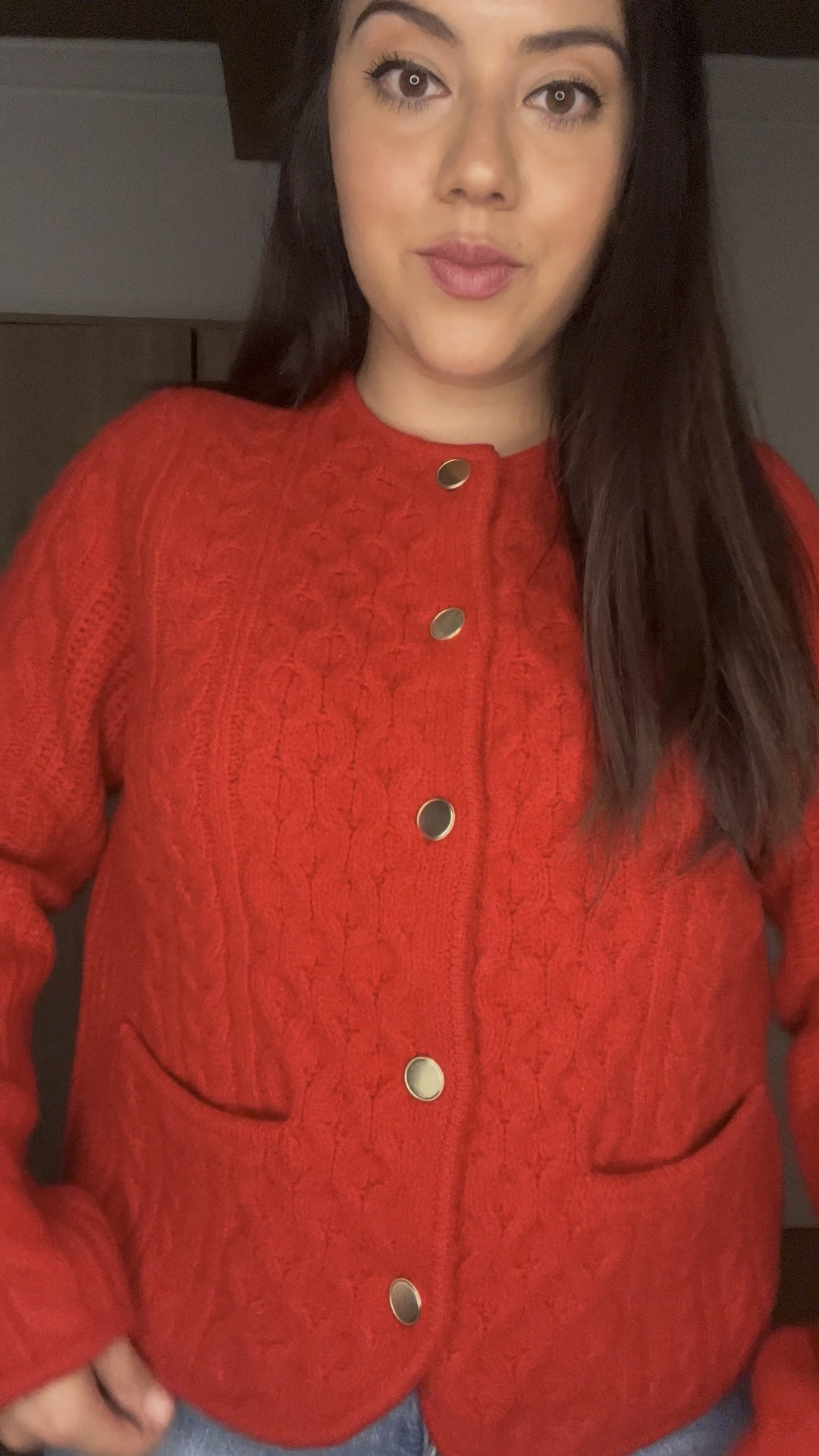This outfit features a bold red textured cardigan with gold button details, giving it a chic and polished look. The structured yet cozy knit pairs effortlessly with classic light-wash high-waisted jeans, creating a stylish contrast between sophistication and casual comfort. This combination is perfect for a trendy yet effortless winter or fall outfit that balances warmth and elegance. 

#LTKSeasonal #LTKMostLoved #LTKWatchNow