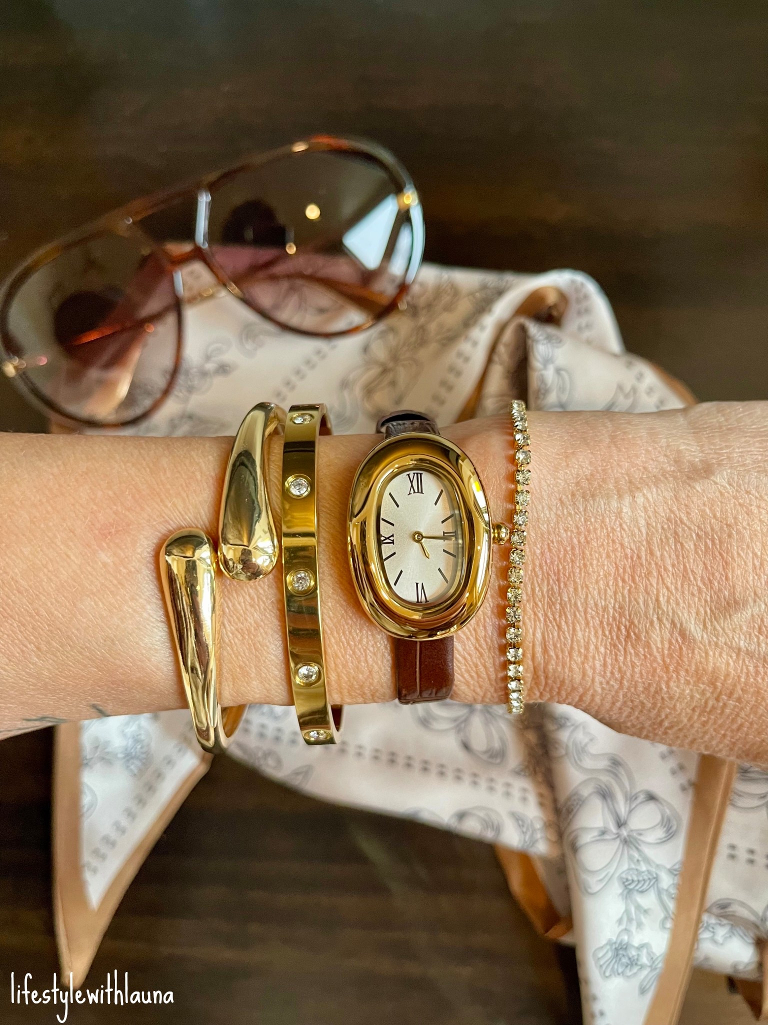 Beautiful accessories! Gold watch, gold bangle bracelets, oversized sunglasses & neck scarf. 
Amazon finds that look high end! Accessories always make the perfect gift for her!

amazon fashion, affordable style, over 40 mom, workwear, gold watch, gold bracelet

#LTKOver40 #LTKFindsUnder50 #LTKGiftGuide