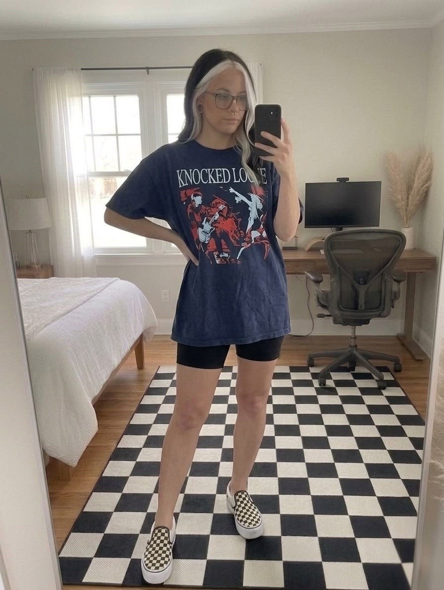 Obsessed with this effortless, edgy look! 
Keeping it comfortable but cool today with an oversized band tee and classic casual staples.

I paired this graphic Knocked Loose band t-shirt with high-waisted black biker shorts for the ultimate trendy, oversized silhouette. To tie the whole alternative look together, I added my favorite checkered slip-on platform sneakers. They perfectly match the checkerboard area rug in my bedroom decor!

This outfit is perfect for casual summer days, concert outfits, or just lounging in style.

#LTKootd #LTKSeasonal #LTKMidsize