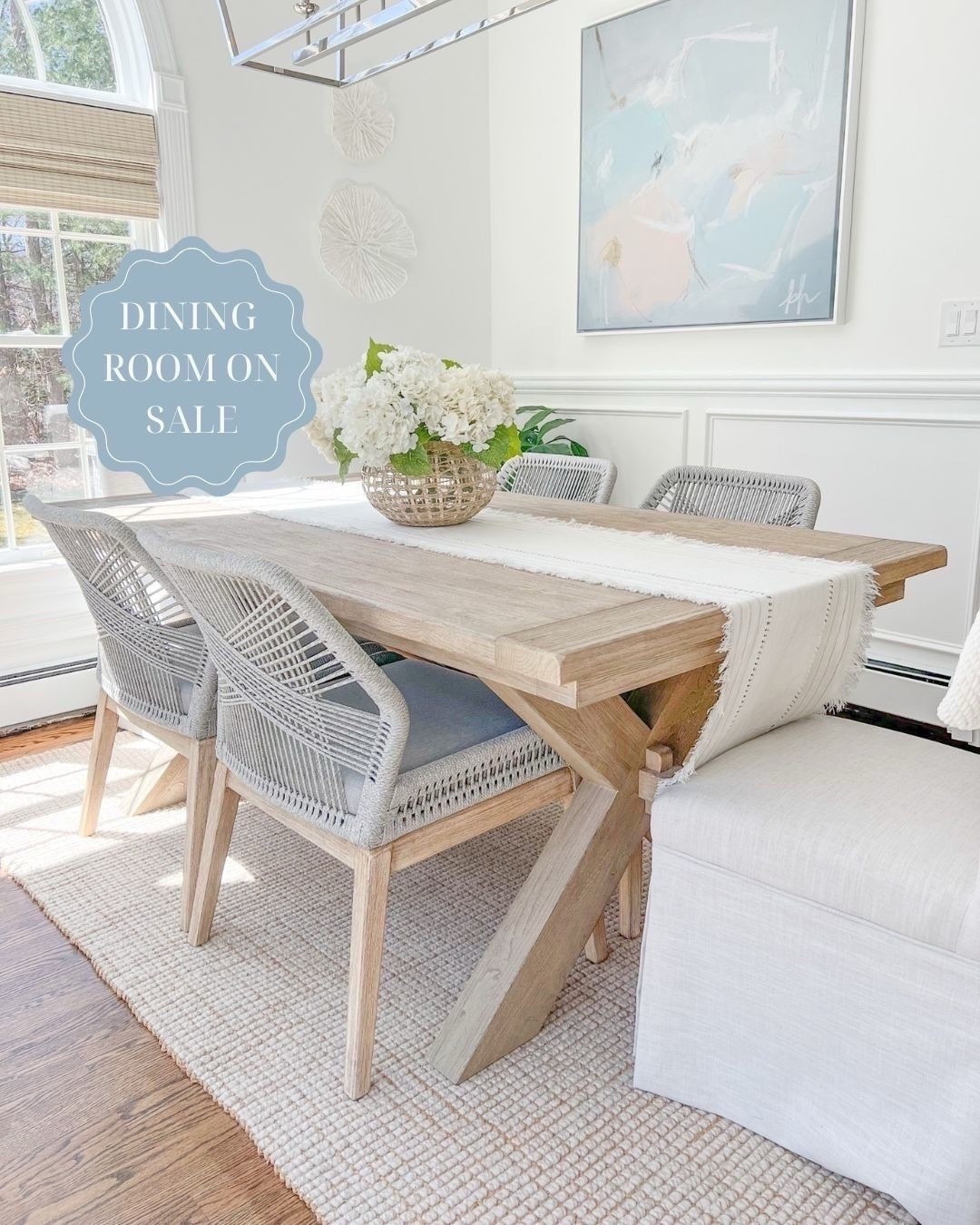 My dining table & rug are on sale! My table, in the seadrift finish, is the 74"-104" size, my rug is the natural color, and my woven shades are "tibet ivory." 
---- 
coastal dining room, dining room decor, neutral dining room, neutral home decor, neutral decor, beach decor, beach style, dining room furniture, dining room ideas. faux flowers, amazon hydrangeas, woven vase, large vase, serena & lily vase, coral wall decor, dining room table chairs, pottery barn dining table, Toscana dining room table, dining room chairs, dining room rugs, pottery barn rugs, coastal rugs, coastal artwork, abstract artwork, large artwork, blue artwork, woven shades, 8x10 rugs, 5x8 rugs, 9x12 rugs, dining room tables on sale, dining room ideas, dining room decor, white dining room, jute rugs, wool rugs, neutral rugs, dining tables with leafs, home sales, dining tables on sale

#LTKHome #LTKSaleAlert