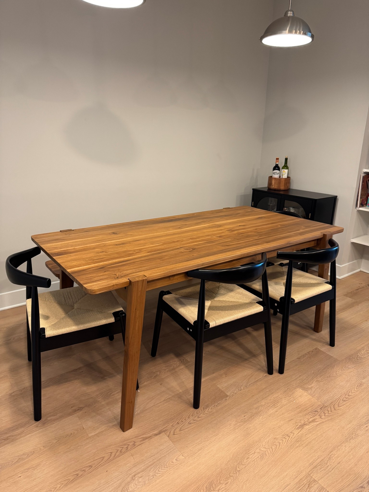 Natural solid wood dining table and bench and black and natural dining chairs. 

#LTKHome