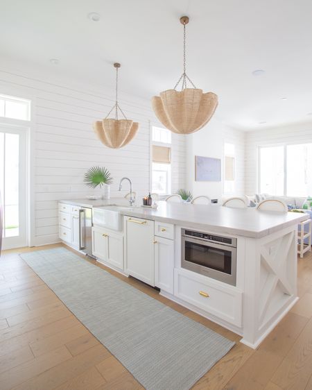 Sharing a mini tour of our new Florida home today! Includes items in our kitchen like our rope chandeliers, swivel counter stools, indoor/outdoor runner rug, brass cabinet hardware, striped marble vase, chrome kitchen faucet, woven Roman shades and so much more! See the full tour here: https://lifeonvirginiastreet.com/a-peek-at-our-new-florida-home/.
.
#ltkhome #ltkseasonal #ltksalealert #ltkfindsunder50 #ltkfindsunder100 #ltkstyletip #ltkover40 #ltkfamily


#LTKhome #LTKSeasonal #LTKsalealert