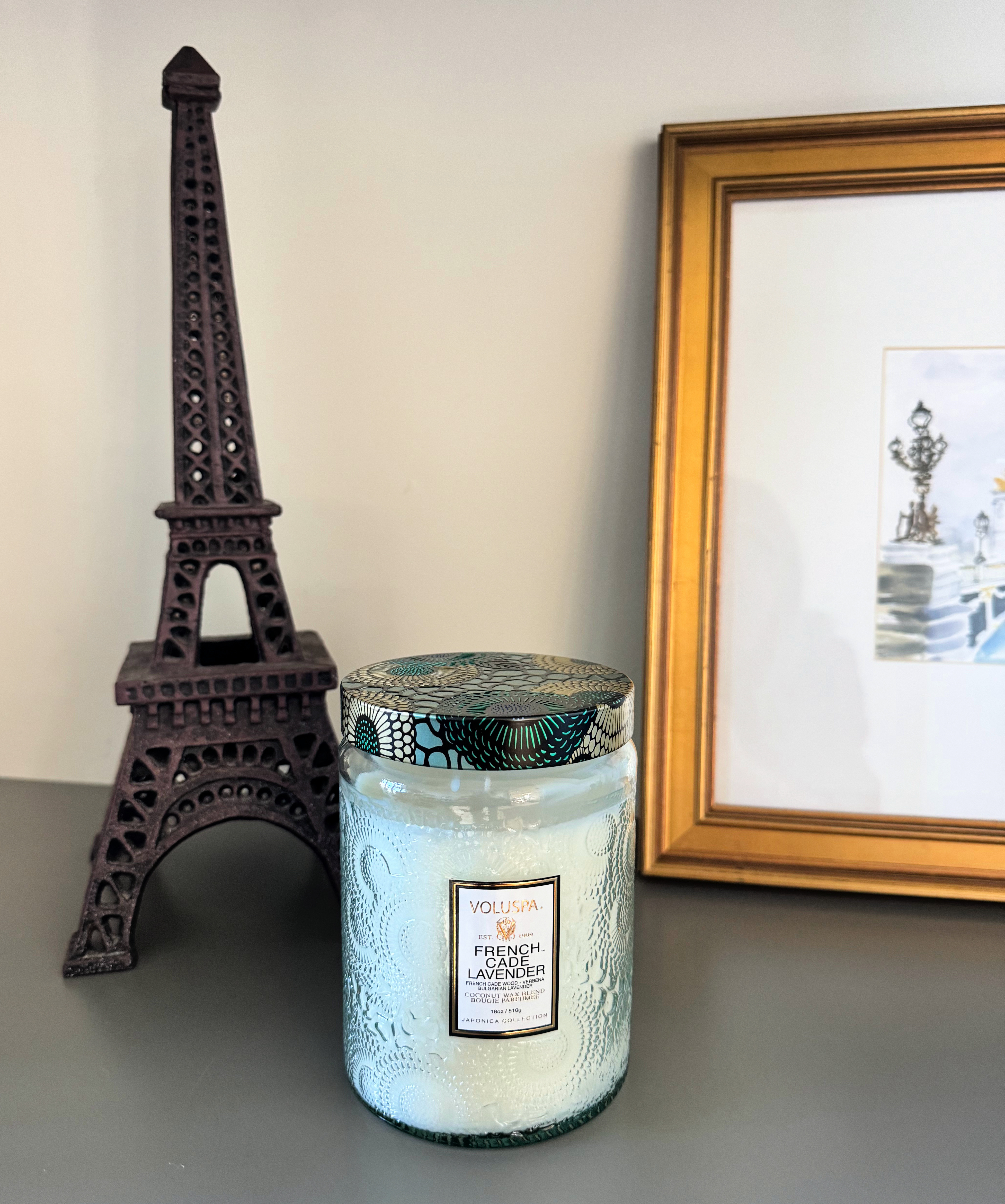 The scent of the South of France… with a hint of Paris. 💜

Voluspa truly knows me—this French Cade Lavender candle feels like it was made for my world. It’s soft, herbaceous, and calming, like wandering through lavender fields in Provence and then returning to a quiet Paris apartment at dusk.

Paired here with my little Eiffel Tower and a watercolor of Paris—because somehow this scent holds both places at once. 

 #LTKMothersDay #LTKselfcare #LTKHome