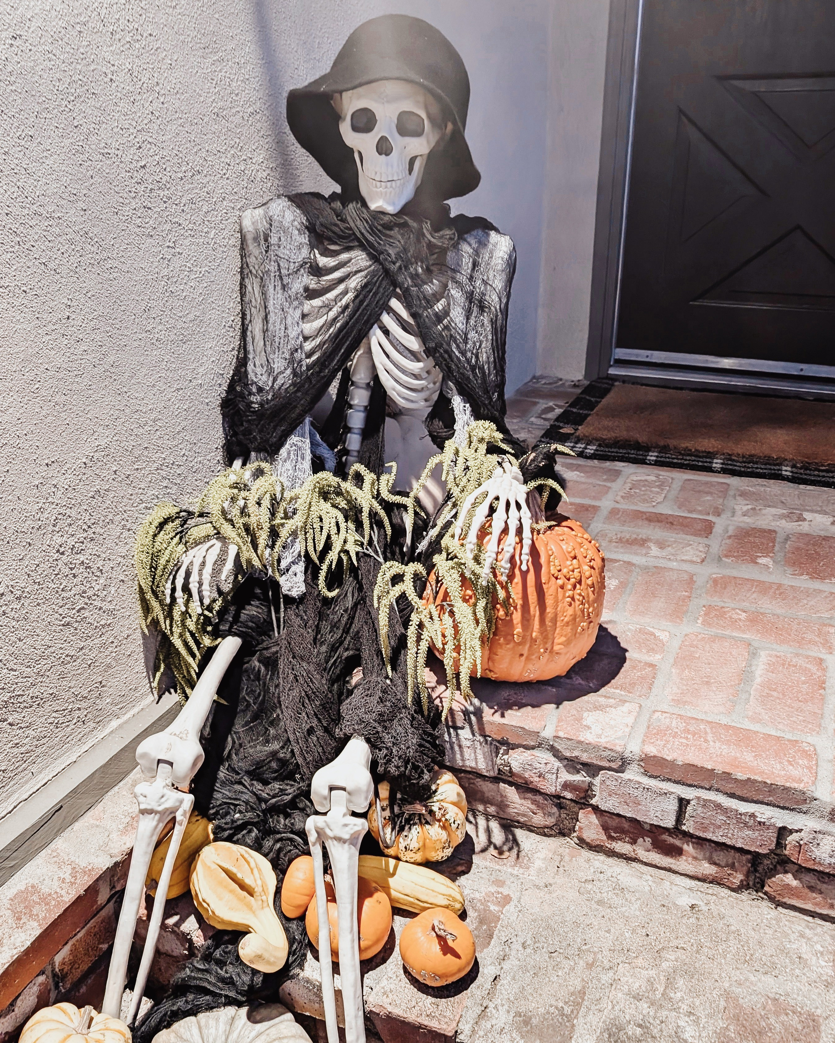 A simple skeleton with pumpkins to greet visitors at your door 🎃

#LTKHalloween #LTKHoliday #LTKHome