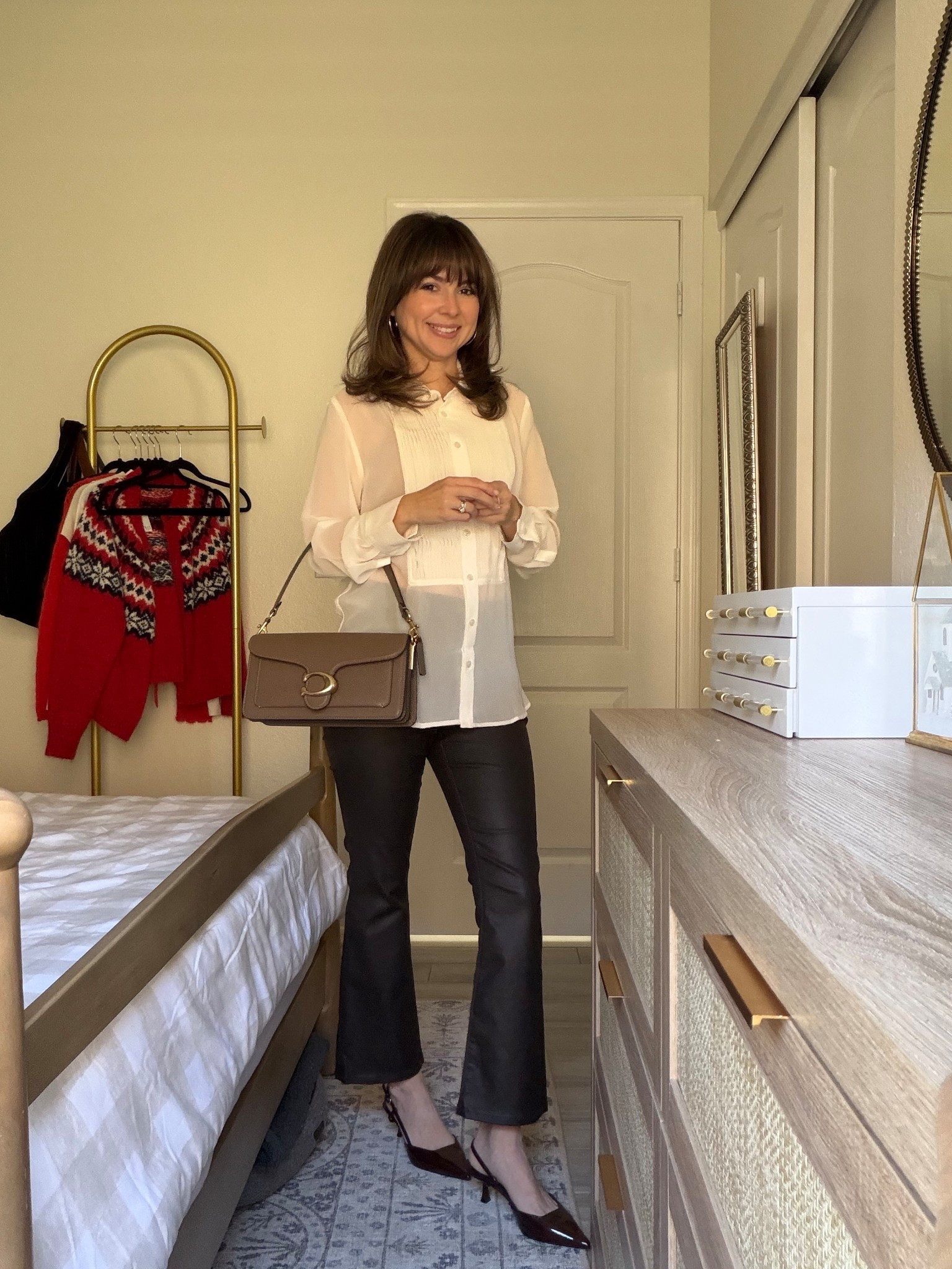 This is my go-to day-to-night bag because it works with everything. I styled it casually with jeans and a sweater during the day, then dressed it up at night with a blouse and faux leather pants — no bag switch needed. Classic, wearable, and actually practical for real life.

Everything I’m wearing is linked below.

Comment SHOP below to receive a DM with the link to this post on my LTK ⬇ https://liketk.it/5G2e2 #ltkpetite #ltkgrwm #ltkholiday