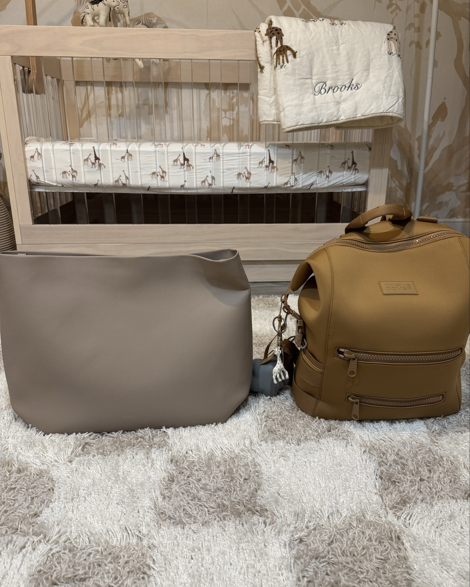 Dads Diaper Bag: Dagne Dover~Indi Diaper Bag Backpack in color Camel size Large. Love this diaper bag as it’s specifically designed to hold baby and toddler esstentials. Holds about anything numerous pockets & pouches. Comes with changing pad and clips to attach to stroller as well. 

Moms Diaper Bag~Mina Baie New Harlow Diaper Bag in color Sand! Most stylish & chic diaper bag perfect for any new mom to be! Super modern & practical, doesn’t even look like a diaper bag! Link isn’t on LTK yet but can purchase on Mina Baies website!

#LTKFamily #LTKTravel #LTKBaby