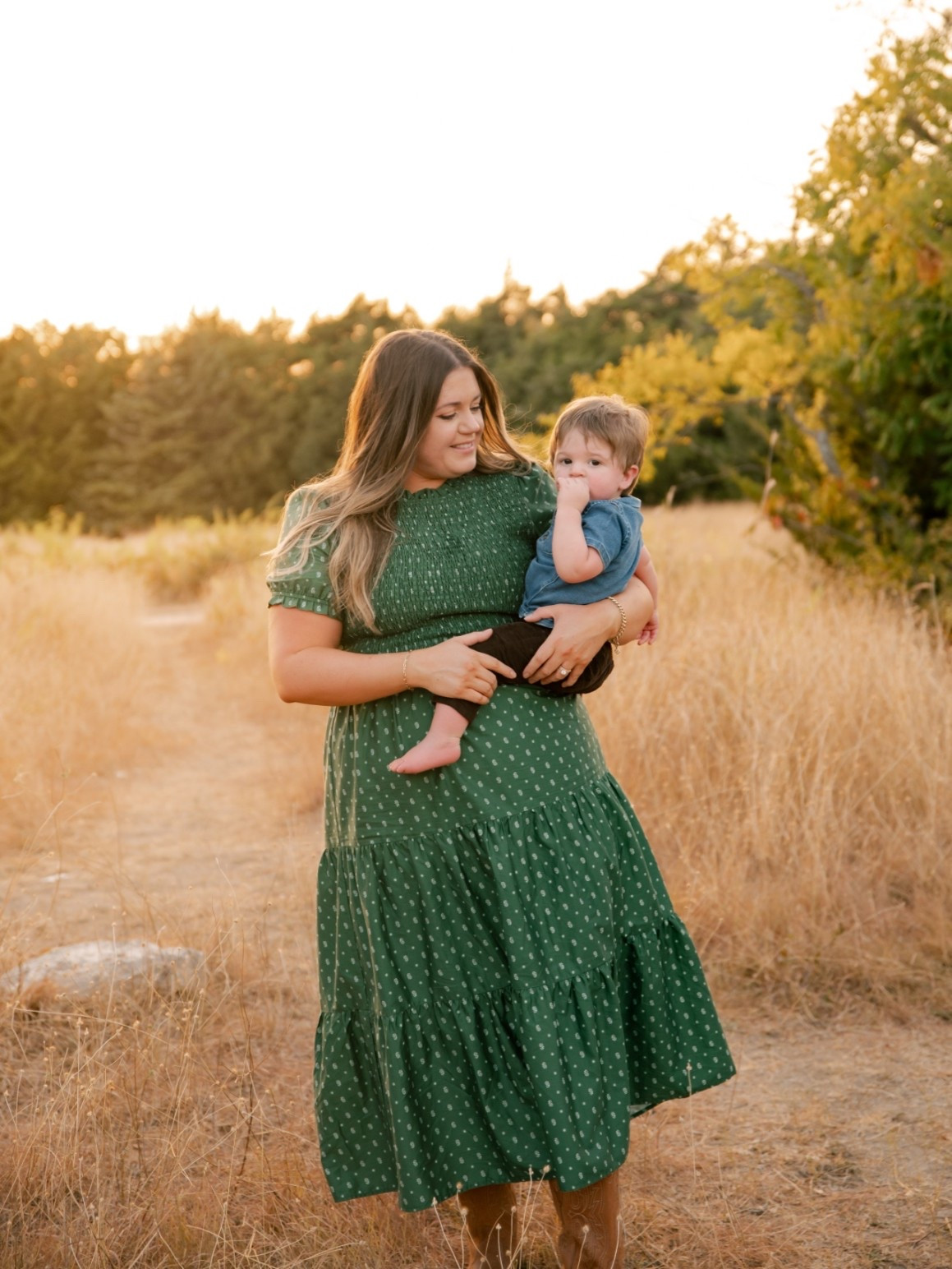 Fall family photo tip: wear the dress you can actually hold your toddler in 🍂 This green smocked midi is comfortable, forgiving, and photographs so well at golden hour. Linked my dress, boots, and Walker's outfit — all budget-friendly!

#LTKootd #LTKmomlife #LTKMidsize