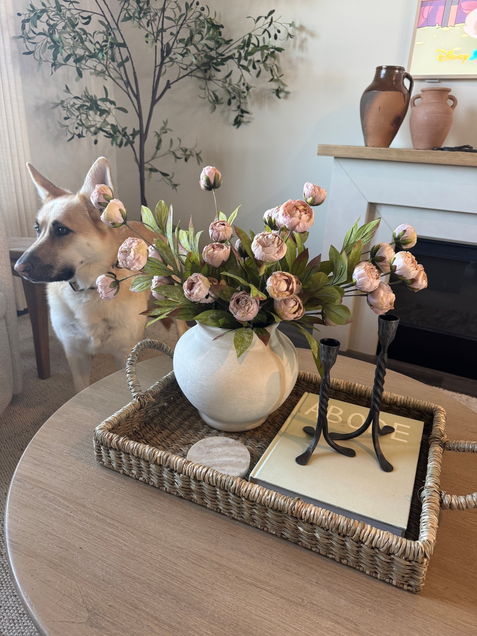 Spring coffee table styling 👏🏼

Round coffee table, peonies, Michael’s stems, iron candle sticks, woven basket, woven tray, living room decor, spring decor 

#LTKSeasonal #LTKHome #LTKFindsUnder100