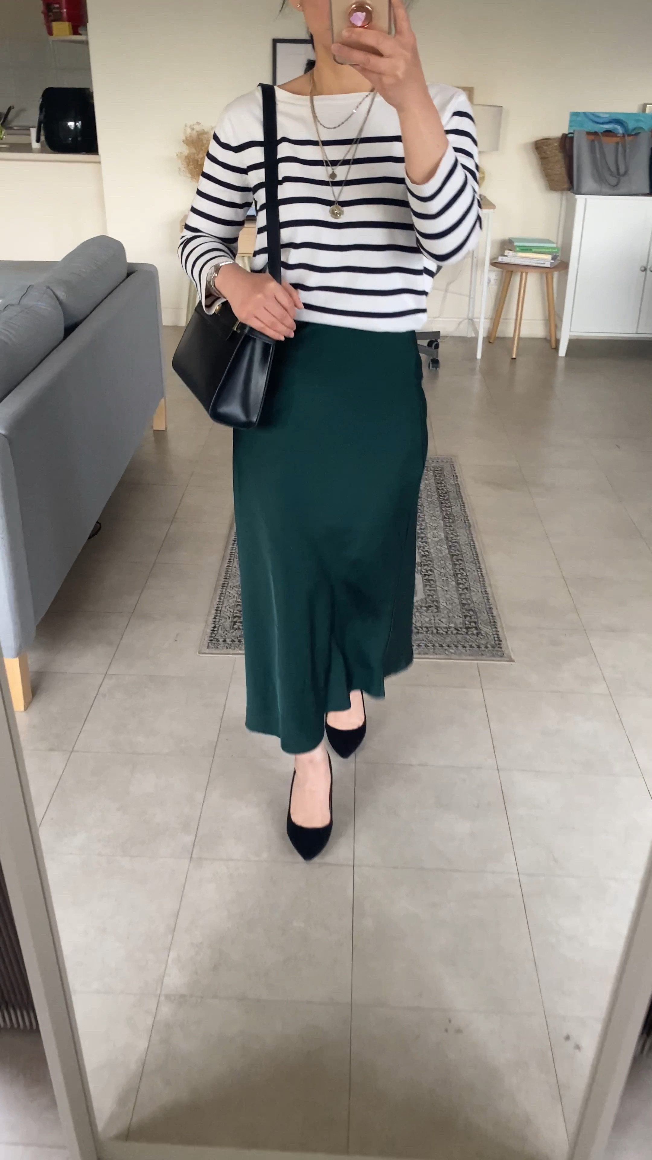 Original inspo for this easy to put together striped knit + satin midi skirt outfit came from & Other Stories while browsing The Iconic  Australia the other day and I thought I’d recreate this with what I already have in my closet!  

The original sweater looks more oversized, loose fitted + has a mock neck (which I think works really well). You can also substitute with any chunky sweater.

Satin skirt is from Forcast (AU 4, sized up fro 6). Length is a more petite friendly at 77 cm in length while &Other Stories version is 82 cm. 

Bag is the Medium Sized Manhattan, which I got thinking I would fit my iPad in there but I think the Small Size might be better in the end. (The Mini Size is also super cute and the white currently on my wish list). Comes in black, white, tan and croc. It was very hard to choose between the colours! But I thought I’ve got too many brown bags already. 

Shoes are old from Witchery, and I have yet to come across a 100% leather shoe under $100 so have linked good old Jimmy Choo Romy 85 that are a classic style. My striped top is also old and have not seen it back at H&M for years (wish they’d restock it as it’s one of my most worn pieces). 

#LTKVideo #LTKaustralia #LTKworkwear