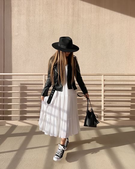Spring outfit - black faux leather moto jacket, tiered midi dress (linked similars), converse style high top sneakers, black fedora hat

// #ltkshoecrush #ltkunder50 #ltkunder100 #ltkitbag spring outfits, spring fashion, spring style, spring dress, Easter dress, midi dress, white dress, spring jacket, jacket, moto jacket, motorcycle jacket, sneakers, converse, Lack of Color, Blank NYC, Amazon fashion

#LTKstyletip #LTKSeasonal #LTKFind