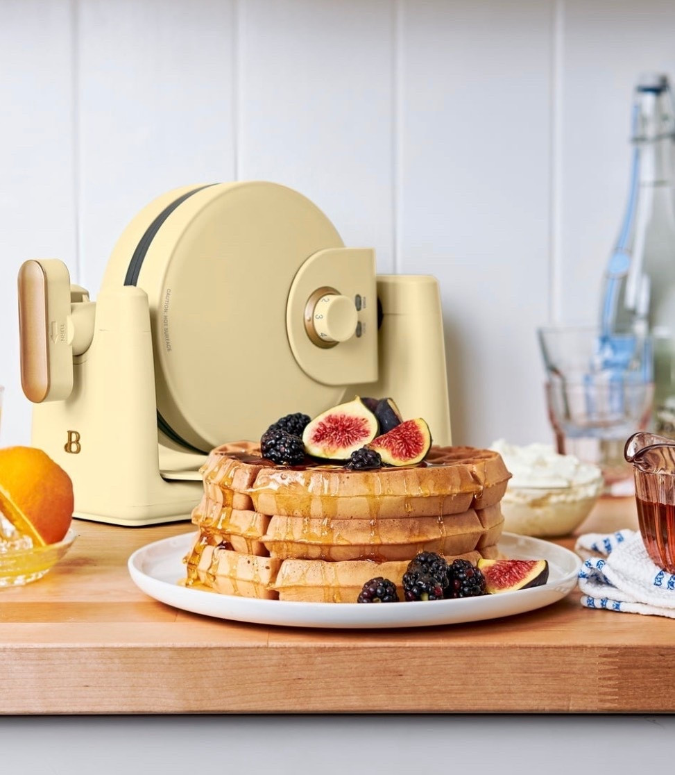 Crush your Easter brunch goals and serve the family light, fluffy and crispy on the outside Belgian waffles right at home with the Beautiful Rotating Belgian Waffle Maker. A powerful 900 watt heating system and easy-to-use rotating mechanism combine to cook five, evenly-cooked round 1”-thick restaurant-quality waffles in only 10 minutes. With seven adjustable browning control settings, you’re in control of cooking each waffle to just the right shade to please all your guests (or yourself!). The waffle plates features EverGood™ ceramic non-stick coating for easy food release and clean up. Plus, its compact size (the handle rotates and folds in) and genius cord wrap makes storage simple. A ready indicator light and cool-touch handle round out the features of this must-have waffle maker. Available in Limited Edition Buttercream with signature gold accents. Exclusively at Walmart #brunch #easterbrunch

#LTKfoodie #LTKmorningroutine #LTKmomlife