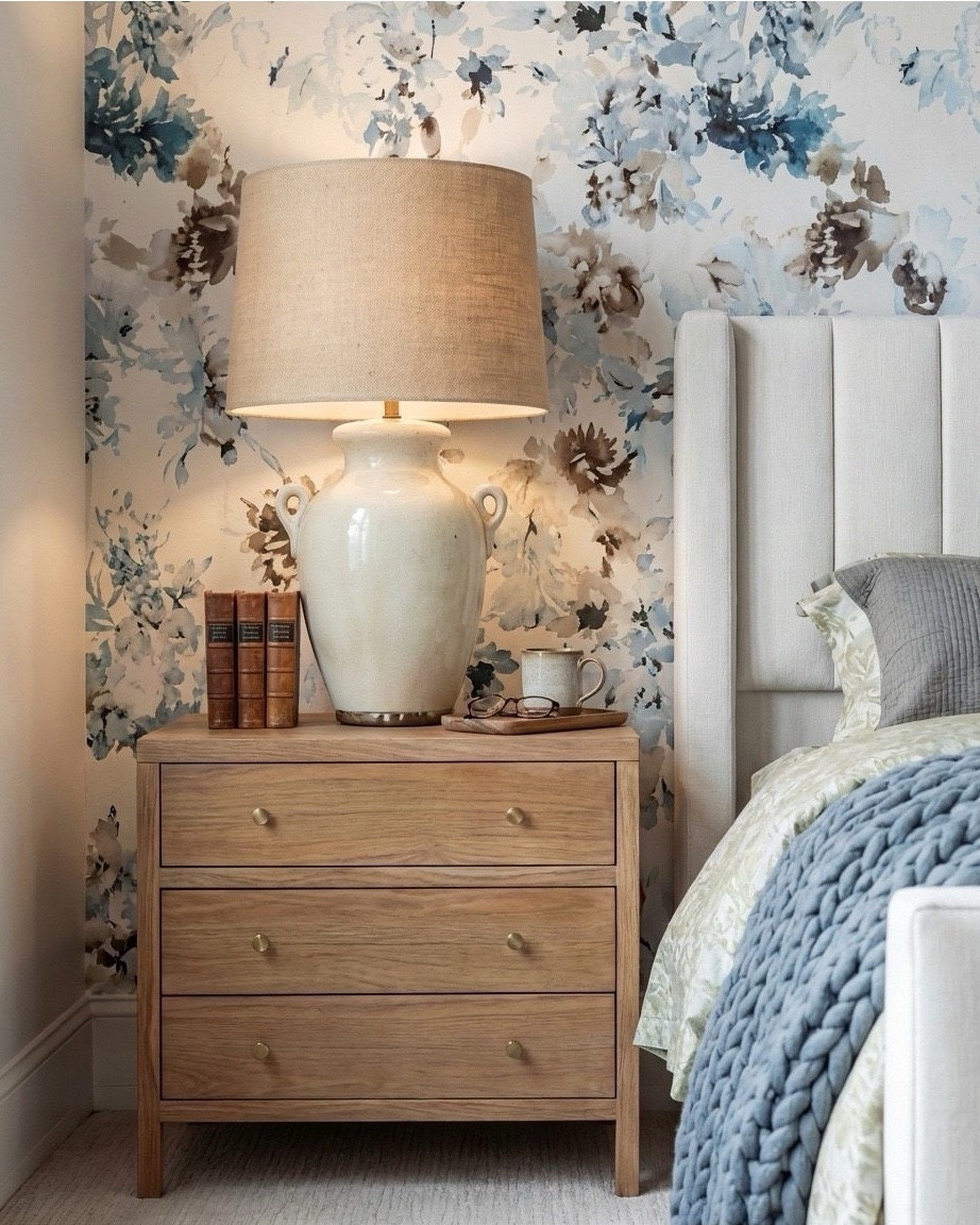 ✨ Shop the Look
Natural wood bed | Chunky blue knit throw | Patterned blue pillows | Caramel cube ottomans | Blue and neutral patterned rug | Brass beaded mirror | Brass table lamps | Soft floral wallpaper | Natural wood  cane nightstands | Exposed ceiling beams, ribbed white decor bowl.

#LTKsale #LTKhome #LTKstyletip
