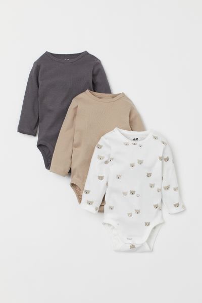 Long-sleeved bodysuits in soft organic cotton jersey, one with printed pattern. Concealed snap fa... | H&M (US + CA)