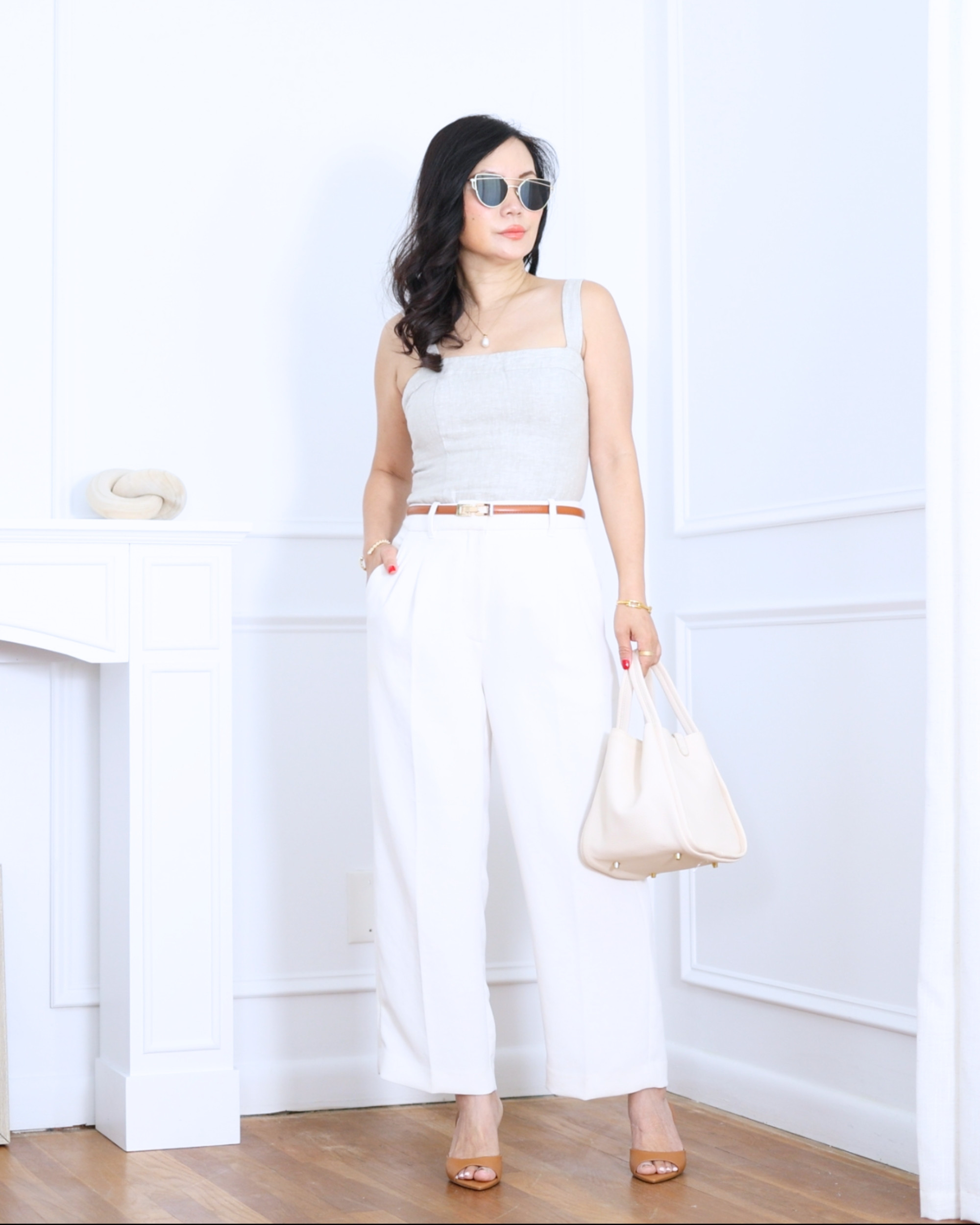 Fitted tank from Quince paired with white pants from Aritzia — clean, minimal, and effortlessly chic. A timeless combination that feels polished, comfortable, and perfect for warm-weather days. I'm 5'2, wearing size S. 

 #LTKootd #LTKOver40 #LTKPetite