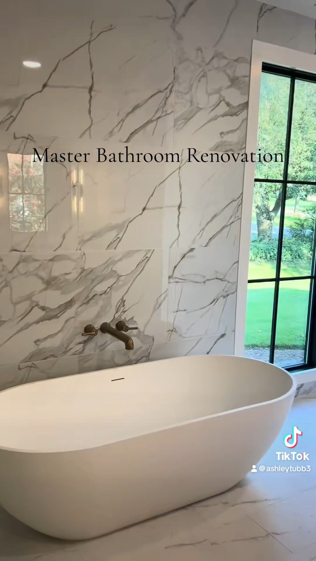 Natural wood, natural lighting & moody sconce lighting gives this Master Bathroom a calm & cozy feel. #bathroomremodel #bathroomdesign #bathroomideas #masterbathroom #homerenovation 

#LTKHome #LTKFindsUnder100 #LTKFamily