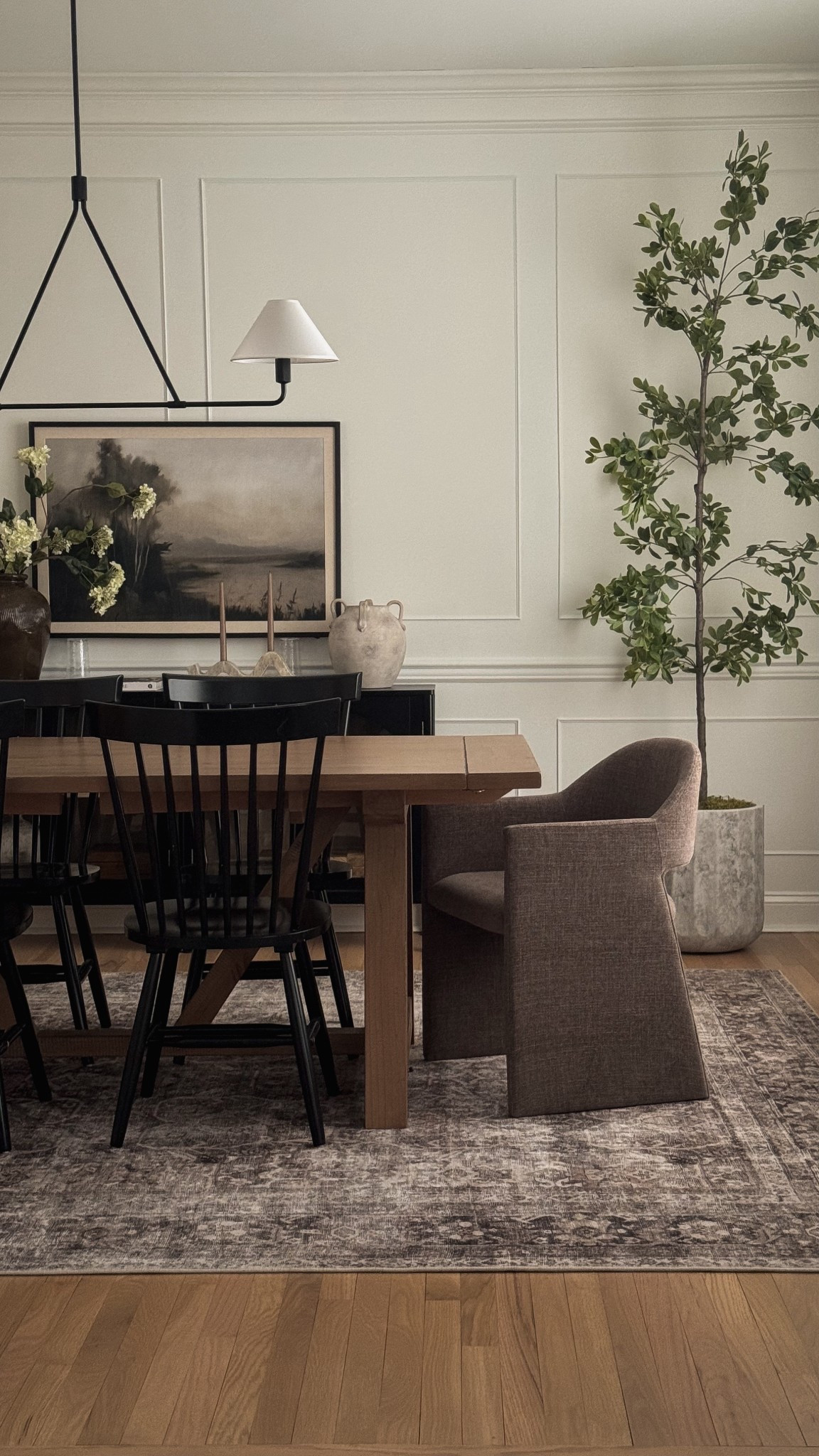 Making some progress! Artwork not hung yet (peep the glassware propping it up LOL) but both the art and stems are from Hobby Lobby. 

Dining room decor, dining chairs, dining table, olive tree, dining room rug, dining room inspo, dining room pendant 

#LTKHome