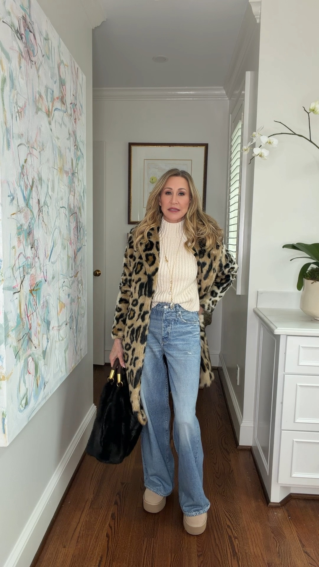 The viral Rag & Bone sweat pant jeans styled with a cream, cropped mock neck, Ugg boots, a fur bag and a leopard coat


#LTKSeasonal #LTKootd #LTKOver40