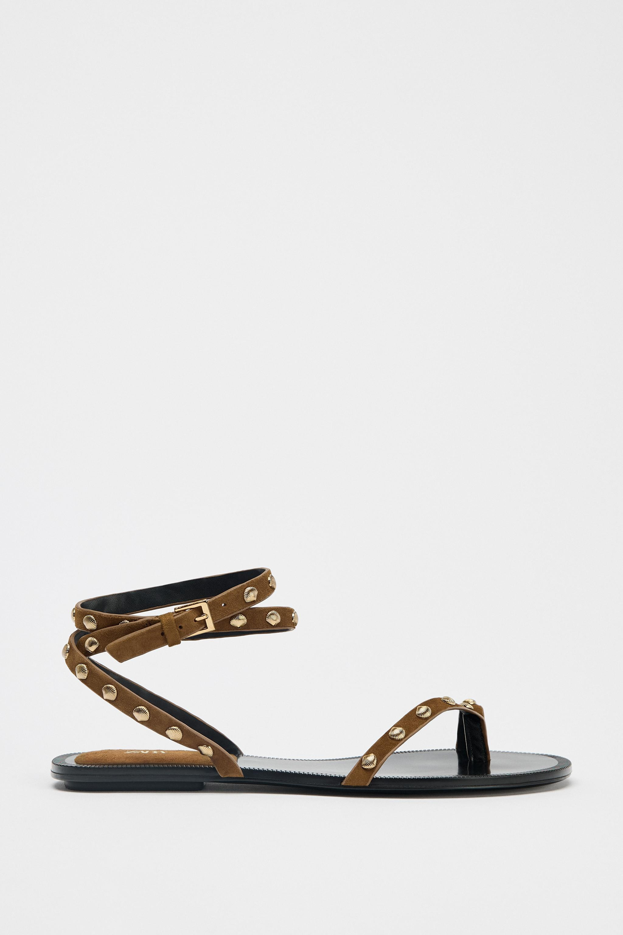 Flat leather sandal. Straps with metal stud detailing in the shape of shells. Back ankle strap wi... | Zara US